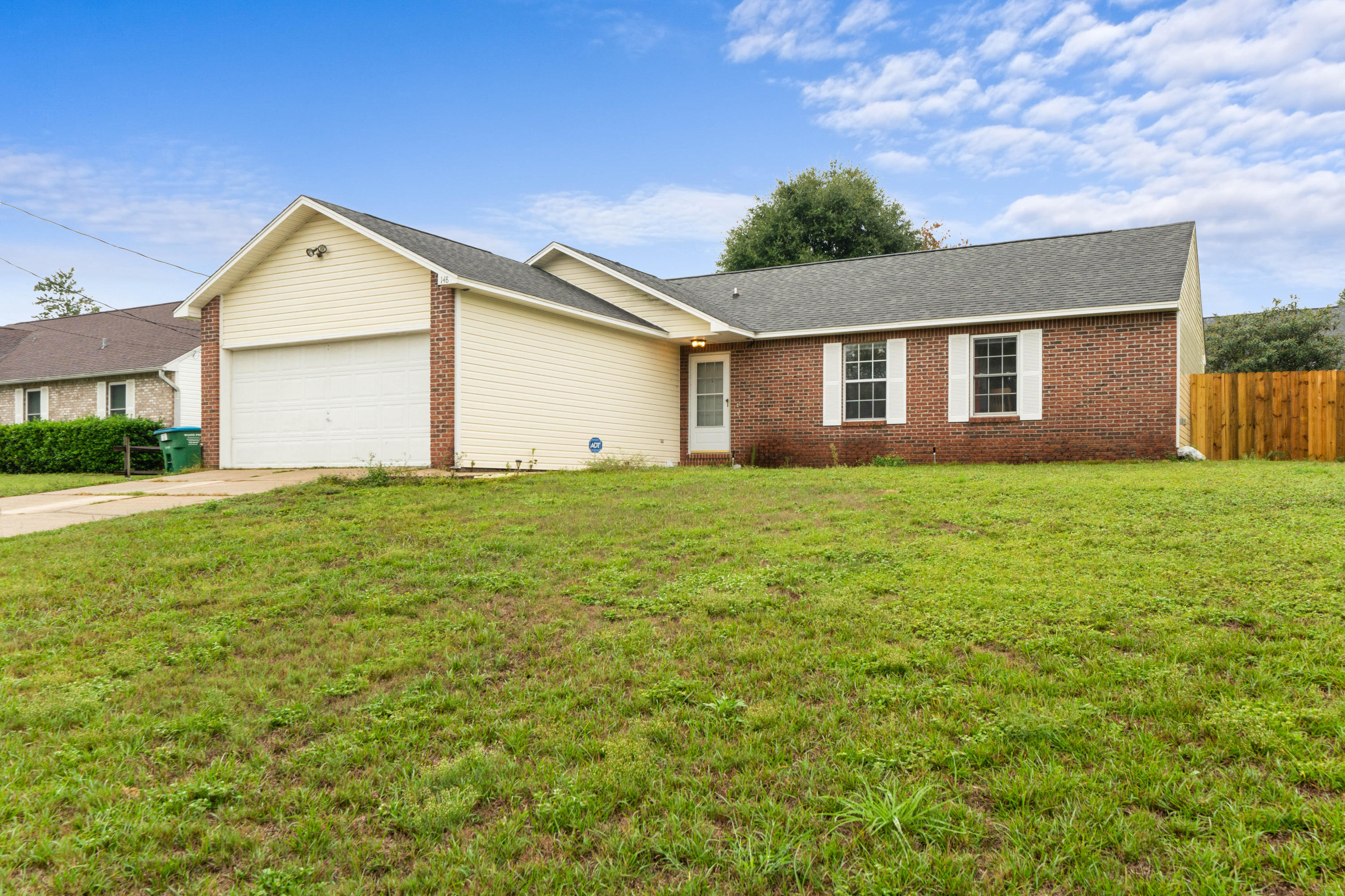 148 Nicole Lane is located strategically near the Crestview Walmart for convenient access to the interstate as well as Highway 85. The home is 3 bedrooms with 2 baths and features a solar panel system that lowers the average summer power bill to about $125! Upon entering the home your drawn to how large the home is, featuring a cathedral ceiling in the Great Room, dining area and the kitchen itself. The kitchen features all appliances along with a French door fridge, and a gray finish on the cabinets. The Great Room itself has a gas log fireplace, cathedral ceiling and plenty of room for the largest of furniture. Down the hall all three bedrooms have laminate floor and ceiling fans. The Master itself also has a cathedral ceiling, large walk in closet as well as full bathroom. Check it out!