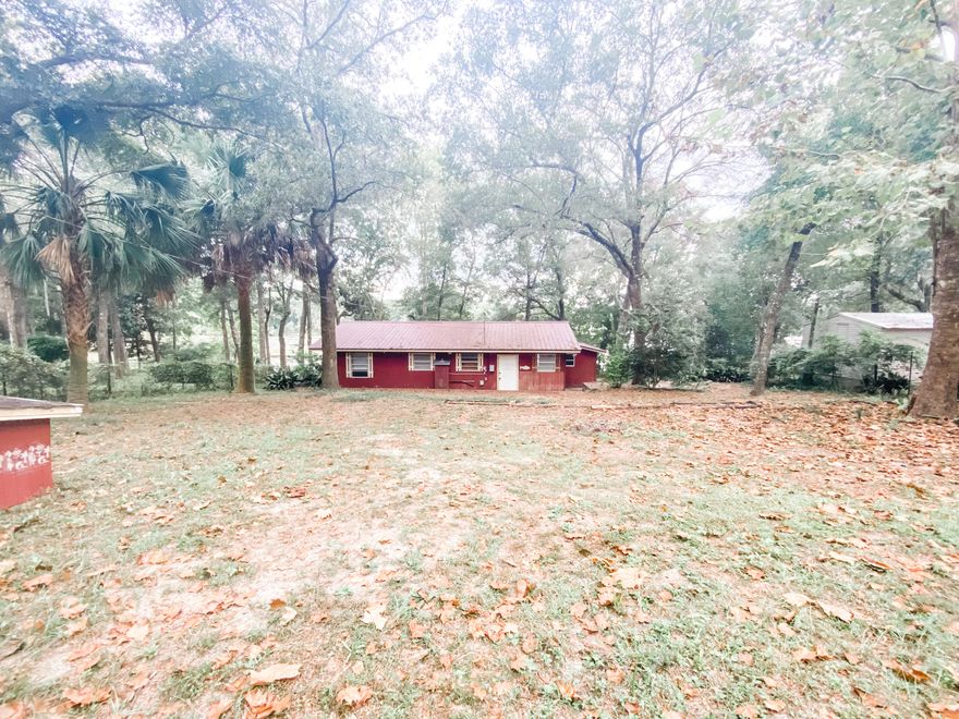 If you are looking for the perfect weekend fishing retreat, this is it! This home has 3 bedrooms, 1 bathroom and an open layout in the kitchen and living area. The enclosed sunroom on the back is perfect for a small family gathering or sipping coffee and watching the sunrise over Lake Juniper. The yard is large and has some beautiful mature trees. There is already a dock in place for the anglers or just to sit and relax! The HVAC was replaced in 2021.