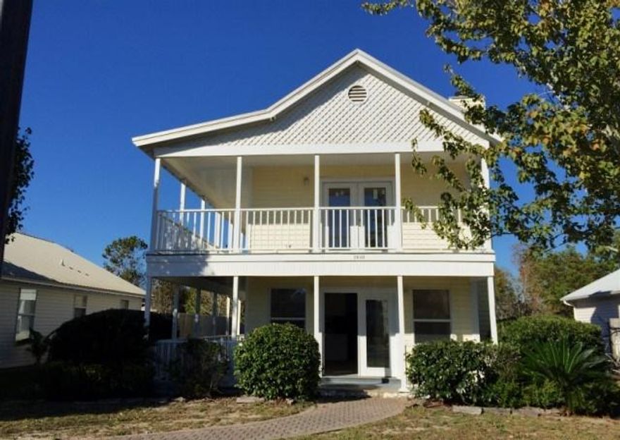 Charming Florida Cottage in Navarre!! The home offers 3 bedrooms & 3 bath rooms as well as fresh paint. The living room offers fireplace. Enjoy the breeze of the beach from either the bottom or top porch... there is over 800 sq ft of porch space! Don't miss out on this great home!