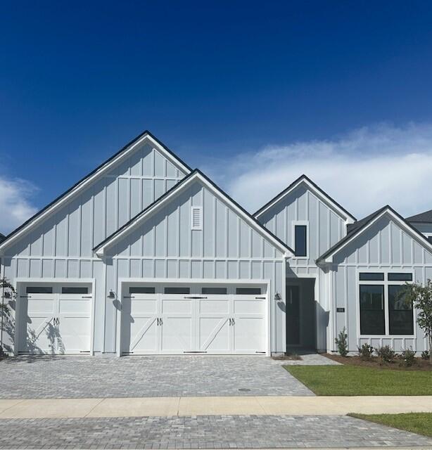 Stunning single-story 3 car garage home, offering 2,839 square feet of living space. Boasting 4 spacious bedrooms, office/flex room and 3.5 beautifully appointed bathrooms, this residence exudes elegance and comfort at every turn. The expansive open floor plan includes a private office room, perfect for working from home, and a three-car garage with a stylish paver driveway. Step into the heart of the home, the gourmet open kitchen. Here, you'll find exquisite quartz countertops, a sleek tile backsplash, and stainless steel appliances, making it ideal for both cooking and entertaining. Throughout the home, luxury vinyl plank flooring creates a seamless flow, while the bathrooms feature elegant tile finishes. The primary suite is a true retreat, with two walk-in closets offering ample storage space and an en-suite bathroom designed to pamper with a spa-like atmosphere large soaking tub and walk-in tile shower. The soaring 12-foot ceilings in the grand foyer set the tone for the home's grandeur, with 10-foot ceilings throughout the rest of the living areas, adding to the airy and open feel. Enjoy outdoor living on the covered paver lanai, which overlooks a serene private wooded preserve, providing the ultimate in peace and privacy. The beautiful gated community enhances your lifestyle, offering easy access to a variety of amenities including a resort-style pool, clubhouse, fitness center, tennis and pickleball courts, playground, multi-purpose field, and much more. Short drive to public beach access, Pier Park shopping, dining and fun entertainment, airport, future FSU/TMH medical campus, future West Bay Center with Publix, and recreation outdoor activities at Frank Brown Park. This home is more than just a place to live; it's a lifestyle waiting to be embraced. Schedule a tour now and lets start your new home journey. Construction complete available for quick move-in.
