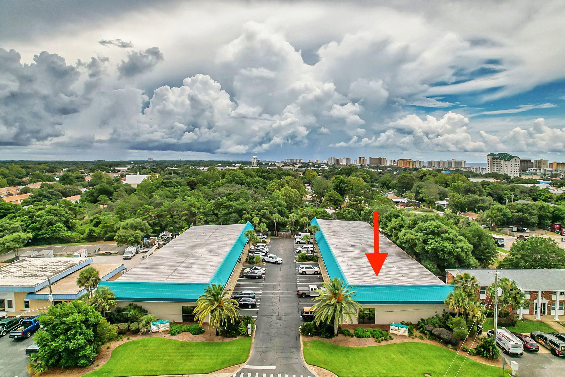 Multiple income producing options in this impeccably maintained commercial property in the heart of Destin. This end unit property has a large reception area, six offices, a kitchenette and bathroom. PLUS a bonus 20x46 garage/work shop with tall overhead door for large equipment and/or vehicles. There are 4 parking spaces PLUS visitor parking spaces. This property could host one business or multiple businesses! The income producing opportunities are endless! With very low overhead, this is a great opportunity to move in your business and rent out remaining spaces. Call today!