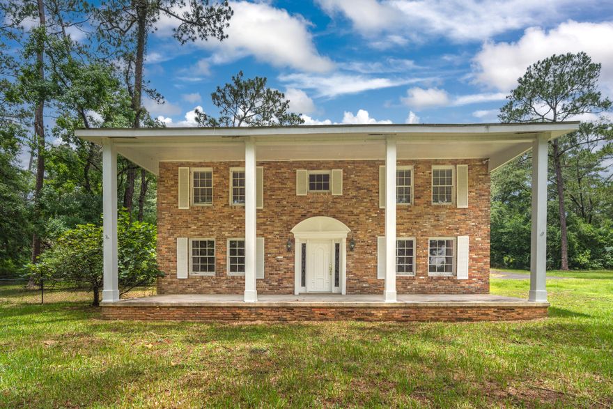 Here is your next Chip and Joanna Gaines opportunity to bring this stately home back to life. This brick colonial-style house is a two-story home that sits on a spacious 5 acre lot, offering plenty of privacy and room to roam. The house features stunning views of a private pond that adds to the overall charm of the property. With over 2,500 square feet of living space, the house includes 4 bedrooms and 2.5 bathrooms, providing ample space for a family to spread out and enjoy. The first floor of the house includes a a formal dining room and a spacious living room with a fireplace. Upstairs, the bedrooms are spacious and well-appointed. The HVAC was replaced in 2021. This house is a beautiful and spacious family home that offers a serene and private setting in the heart of Defuniak Springs