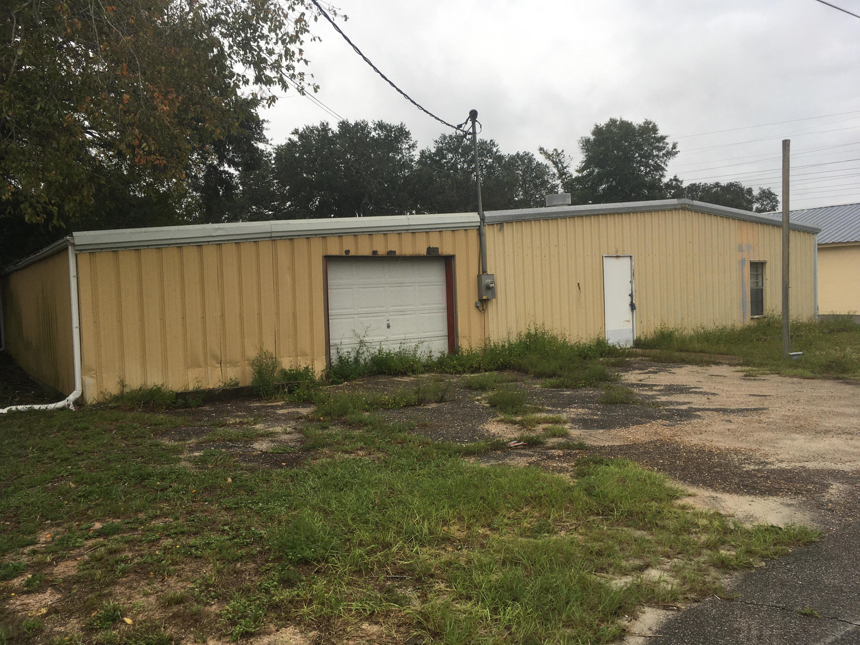 So much potential for this property! Formerly the home of a custom cabinet maker. Property has been vacant for many years and is in need of attention. Check out this diamond in the rough! Buyer to verify square footage and lot dimensions.