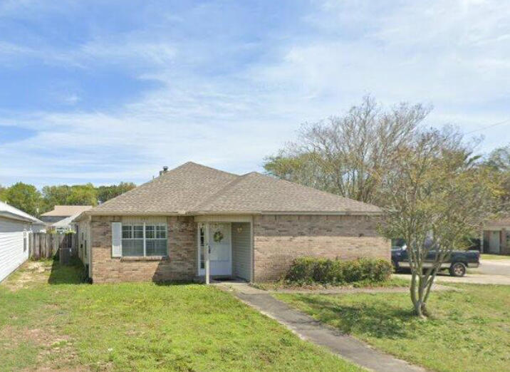 OPEN FLOOR PLAN! 4 bedroom/2 bath with lots of potential!  Brick/Vinyl exterior, Garage has been converted into 4th bedroom and has its own entry/exit door to outside, Master Suite also has its own entry/exit door to outside.  Master bath has garden tub.  Enter the home into the open living room space and continue into the open kitchen with dining space and bar plus an additional living area with fireplace!  There is a screened in back patio with concrete floor.  Needs some TLC but is CENTRALLY LOCATED BETWEEN BASES and within minutes to airport, shopping, colleges, hospital, dining, etc.  BUYER TO VERIFY ALL MEASUREMENTS