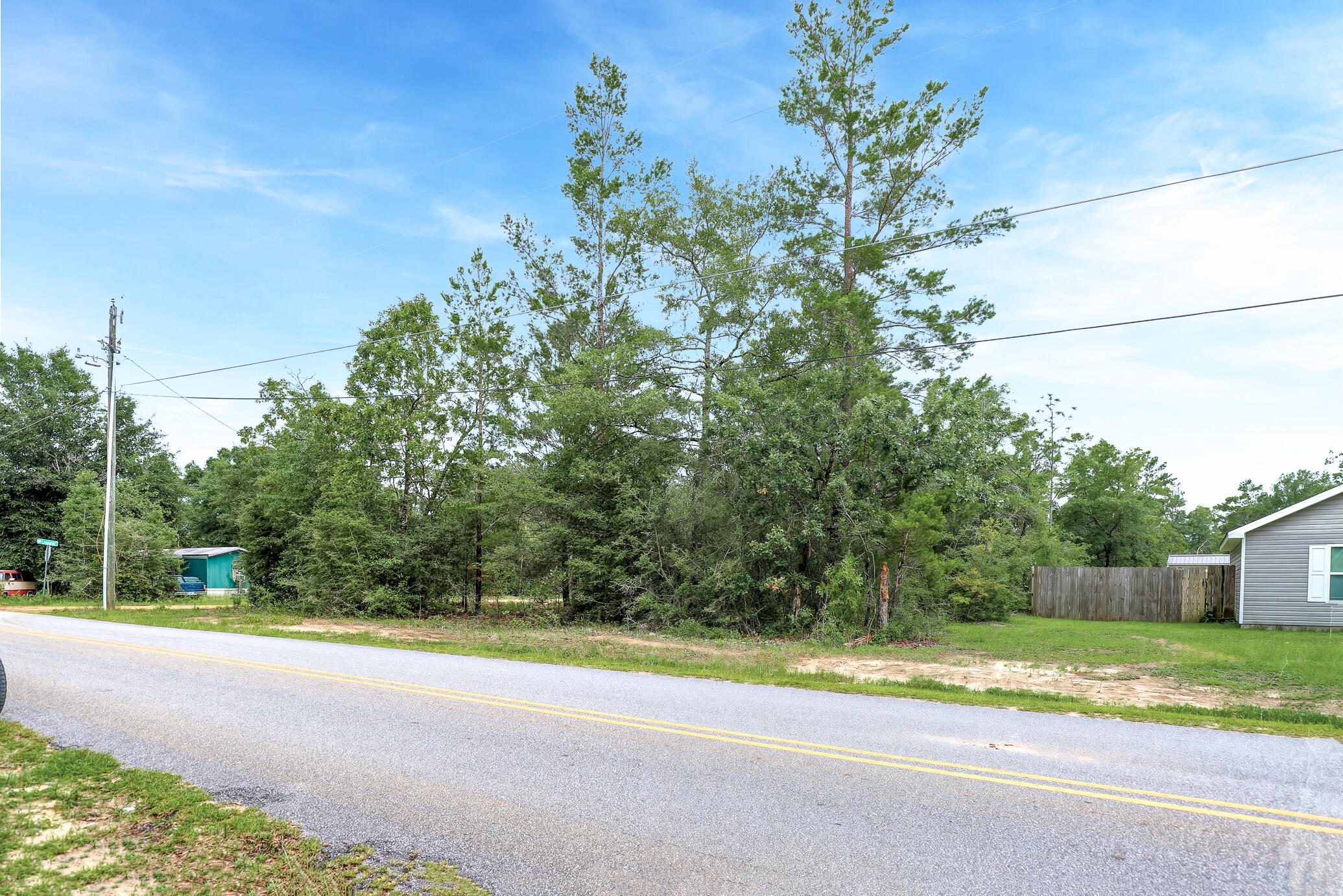 GREAT LOCATION with no HOA fees! Build your getaway home or place a mobile home. Vacant wooded Corner lot, 0.34 of an acre in size with easy access to main highways. 0.7 miles from HWY 90, and less than 7 (seven) miles from hardware and grocery stores, schools, downtown, and the beautiful historic Lake of Defuniak. Nature lovers, this property is near many great outdoor activities like fishing, golfing, national parks, and the beautiful beaches of the Emerald Coast! (Close by popular cities: Niceville, Crestview, Destin Florida, 30A / Seaside, and Panama City Beach)
This high and dry corner lot is located in a NON-flood zone. The Leonard Lane side features a paved, county maintained road, while the Leonard Court side is a private dirt road.
There are no utilities currently on the property.
Power: Available in the area
Water: Would be public water
Sewer: Would require a septic system
Claim your piece of Florida land