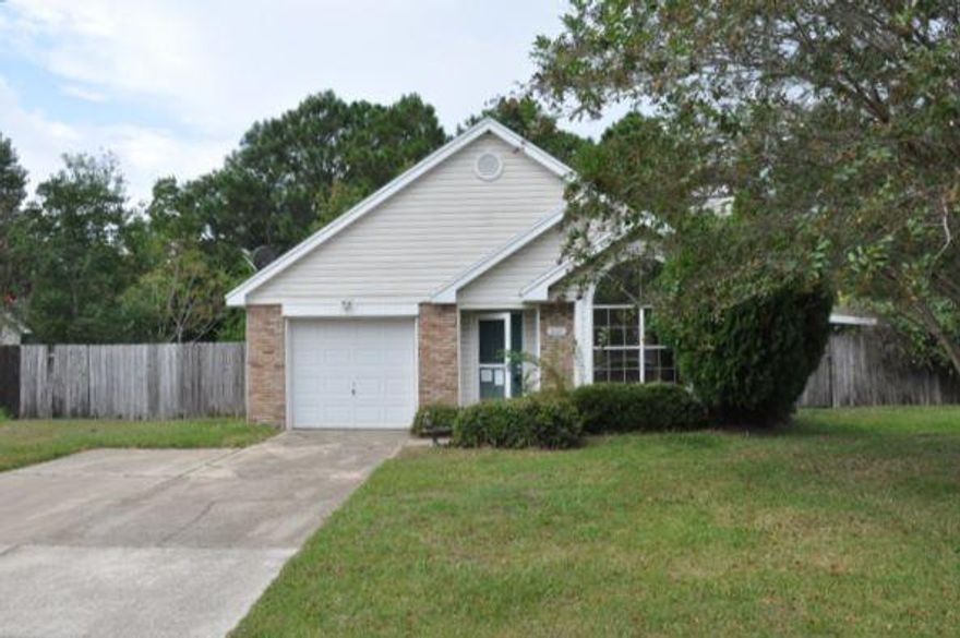 REO. Cozy three bedroom and two bathroom home located 8 miles west of Hurlburt Field's main gate! The Whitney Pines subdivision is quiet and conveniently located near shopping and schools. Living room offers a nice vaulted ceiling, laminate hardwood flooring, and a fireplace to warm up by on those colder evenings. The backyard includes a spacious covered patio... perfect for a hot tub, entertaining, or whatever your needs may be!