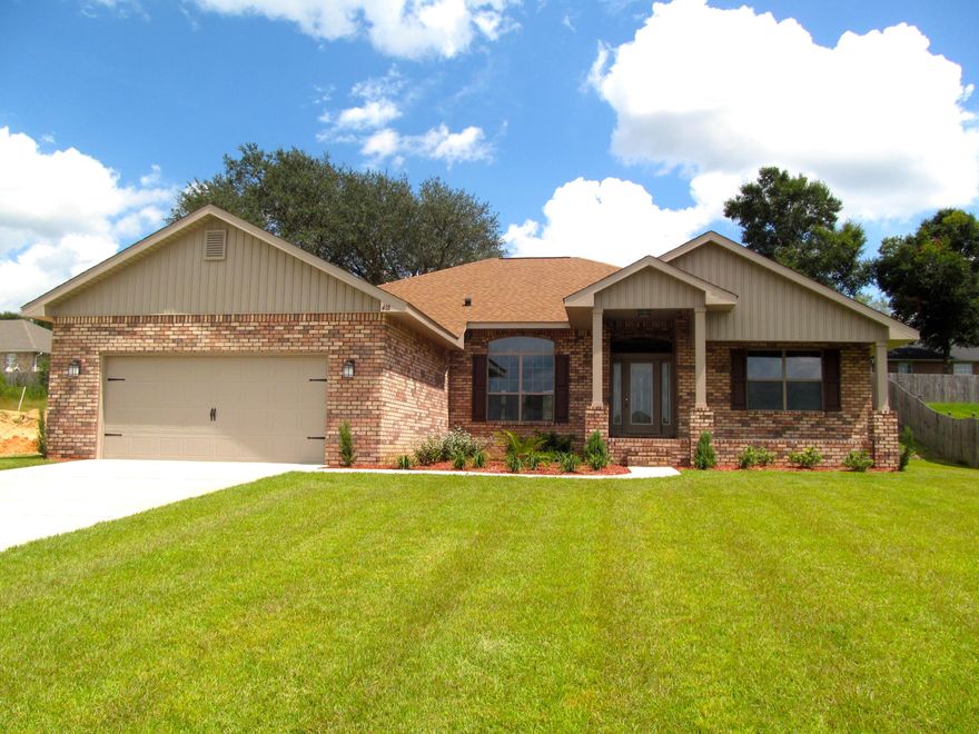 This beautiful brick home has a sprinkler system, landscaping package and craftsman styling to give you all the curb appeal you could want. This 4 bed/3 bath home features a spacious family room with a fireplace. A large kitchen has can lighting and is open to breakfast area that is perfect for family meals, the deluxe master bath has a sep. tub and shower. Enjoy the covered lanai in the back with 3 access doors one which opens directly into a full bath which will help keep the inside of your home free from mud and sand. This home is move in ready and you could be settled in by February. Adams pays closing costs, appraisal and inspection fees plus a 1yr. home and 10 bonded builder warranty. Thru Jan. $10,000 in buyer incentives on this home. Call to schedule a showing today.