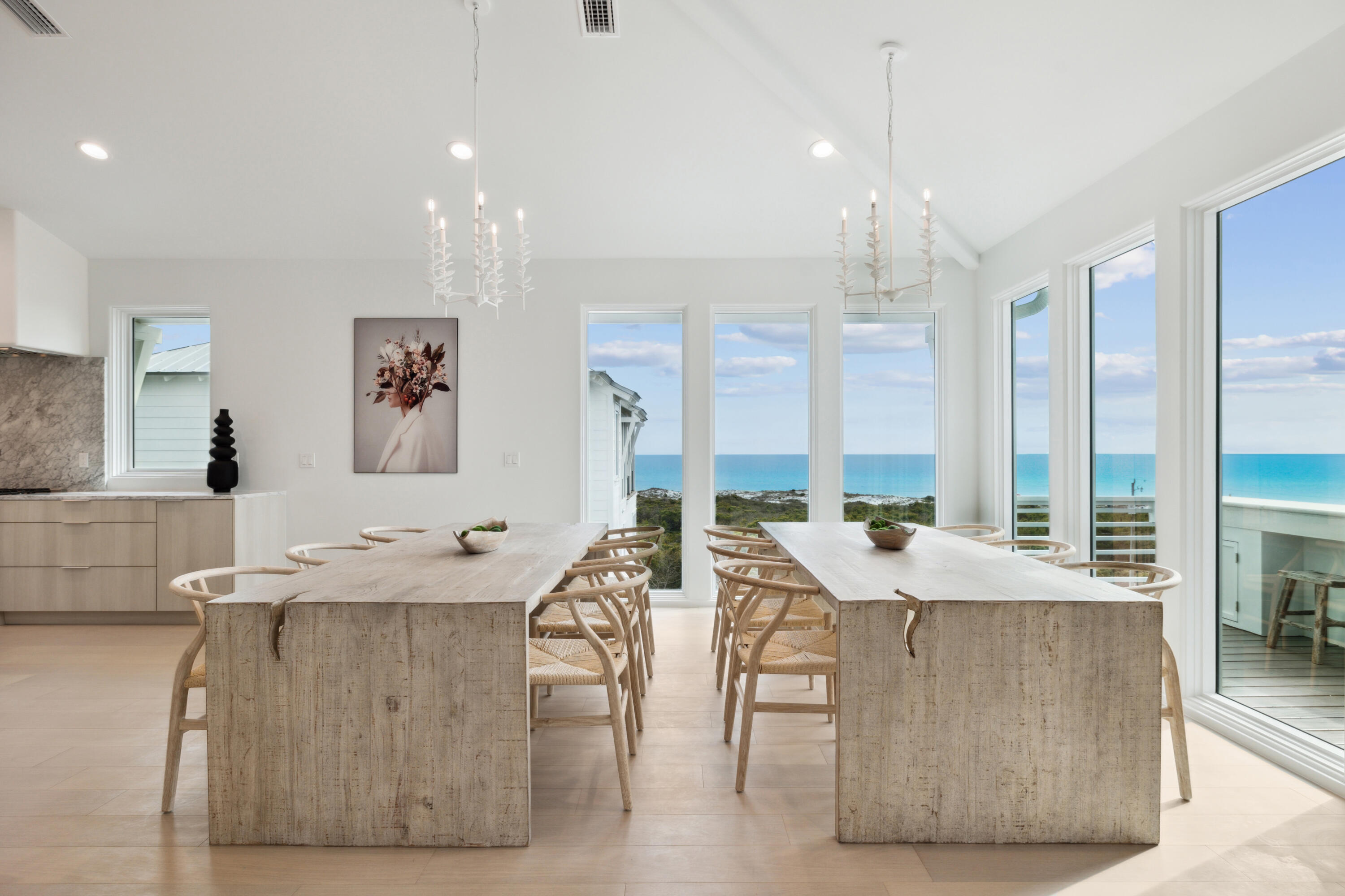 Savor breathtaking sunsets and sweeping gulf views from this newly completed, four-level beachfront residence--an architectural statement of strength and elegance. Built with concrete construction for lasting durability, this expansive home offers more than 6,000 square feet of refined interiors, thoughtfully laid out to accommodate luxurious living and effortless entertaining. With six bedrooms, six full bathrooms and two half baths, the home is both grand in scale and intimate in detail. The entry level sets the tone with Venetian plaster walls and a serene guest suite. A four-stop elevator connects all levels, offering seamless movement throughout the home. The second and third floors host four private primary suites, each with spa-inspired marble bathrooms, floating vanities,