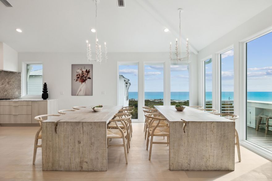 Savor breathtaking sunsets and sweeping gulf views from this newly completed, four-level beachfront residence--an architectural statement of strength and elegance. Built with concrete construction for lasting durability, this expansive home offers more than 6,000 square feet of refined interiors, thoughtfully laid out to accommodate luxurious living and effortless entertaining. With six bedrooms, six full bathrooms and two half baths, the home is both grand in scale and intimate in detail. The entry level sets the tone with Venetian plaster walls and a serene guest suite. A four-stop elevator connects all levels, offering seamless movement throughout the home. The second and third floors host four private primary suites, each with spa-inspired marble bathrooms, floating vanities,