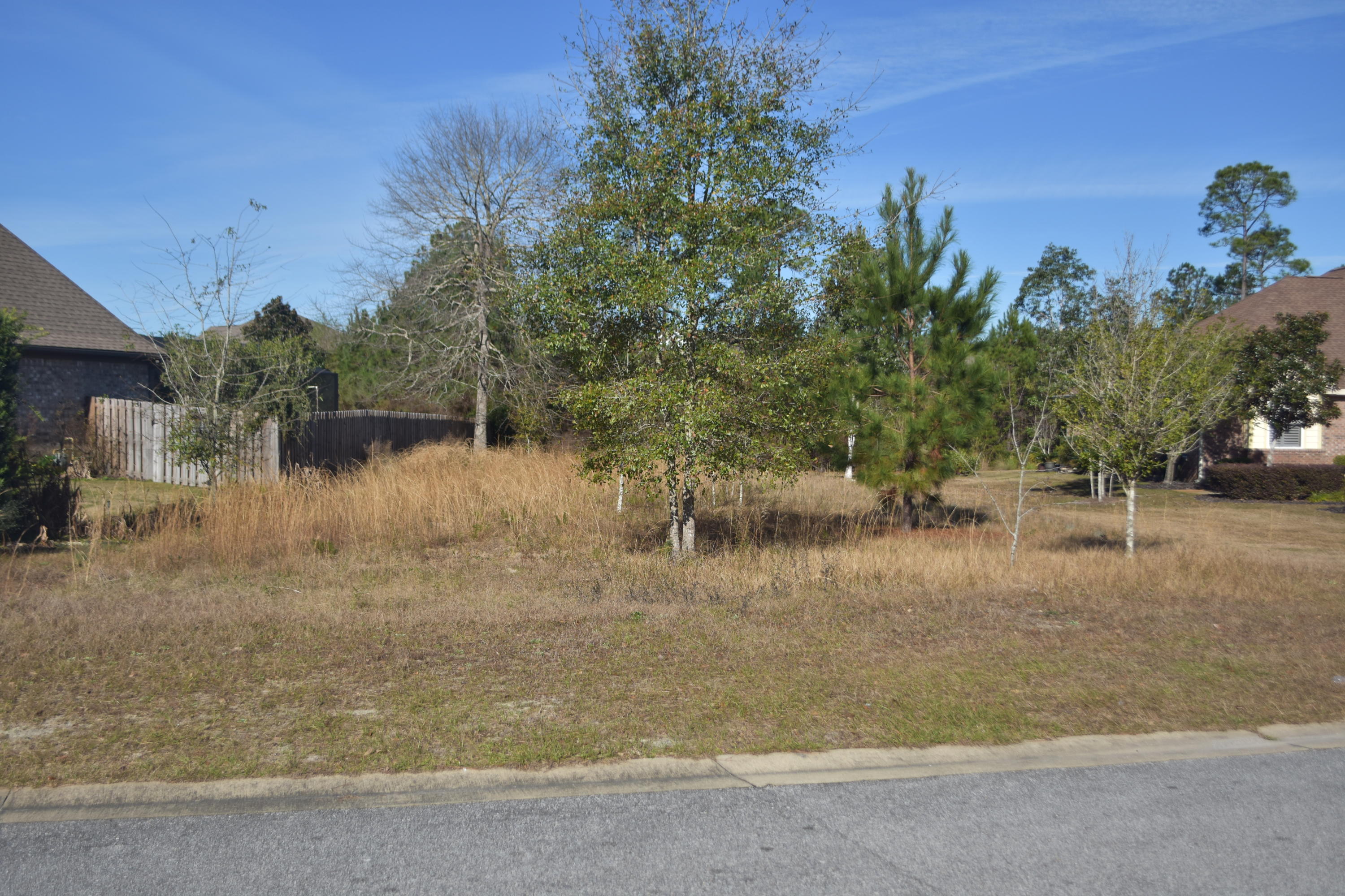 Mostly cleared vacant Lot in Whispers at Hammock Bay, ready to build your dream home! Whispers does not have the CDD tax bond, this is a huge savings! Situated in the cul de sac on Quiet Cove in between two custom built homes. Need a builder? We can help you with that too! This lot backs to a preserve for rear privacy. Take a look, you can find most information in the documents tab.Hammock Bay is a pedestrian friendly development. There are network of sidewalks, nature trails, and bike paths. The Hammock Bay Town Square lawn style amphitheater is designed for entertainment. There is also a $12+ million, 60 acre Sports Park featuring a multitude of ball field/park amenities nearby. Recently the developer donated land for two schools to be built in Hammock Bay.The Lake Club at Hammock