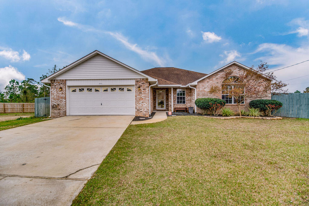 Beautiful all brick 4 bedroom 2 bath Pool home on a cul de sac.  Perfect location to Navarre High School, YMCA & NYSA .  Home sits on a large lot with an in ground pool perfect to enjoy Florida living.  As you enter the home you are greeted with a large vaulted ceiling great room with built-ins along one wall perfect for entertaining & watching movies.  Wood look tile flooring in main living areas.  Tile in wet areas, & newer carpet in bedrooms.  As you go through the great room you enter the large kitchen with newer black stainless steel appliances & lots of  counter space.  Large dining area off of kitchen perfect to host family dinner night.  Main bedroom is spacious, & Main bathroom has double sinks, 2 sizeable walk-in closets, separate water closet, separate shower & Jacuzzi tub.