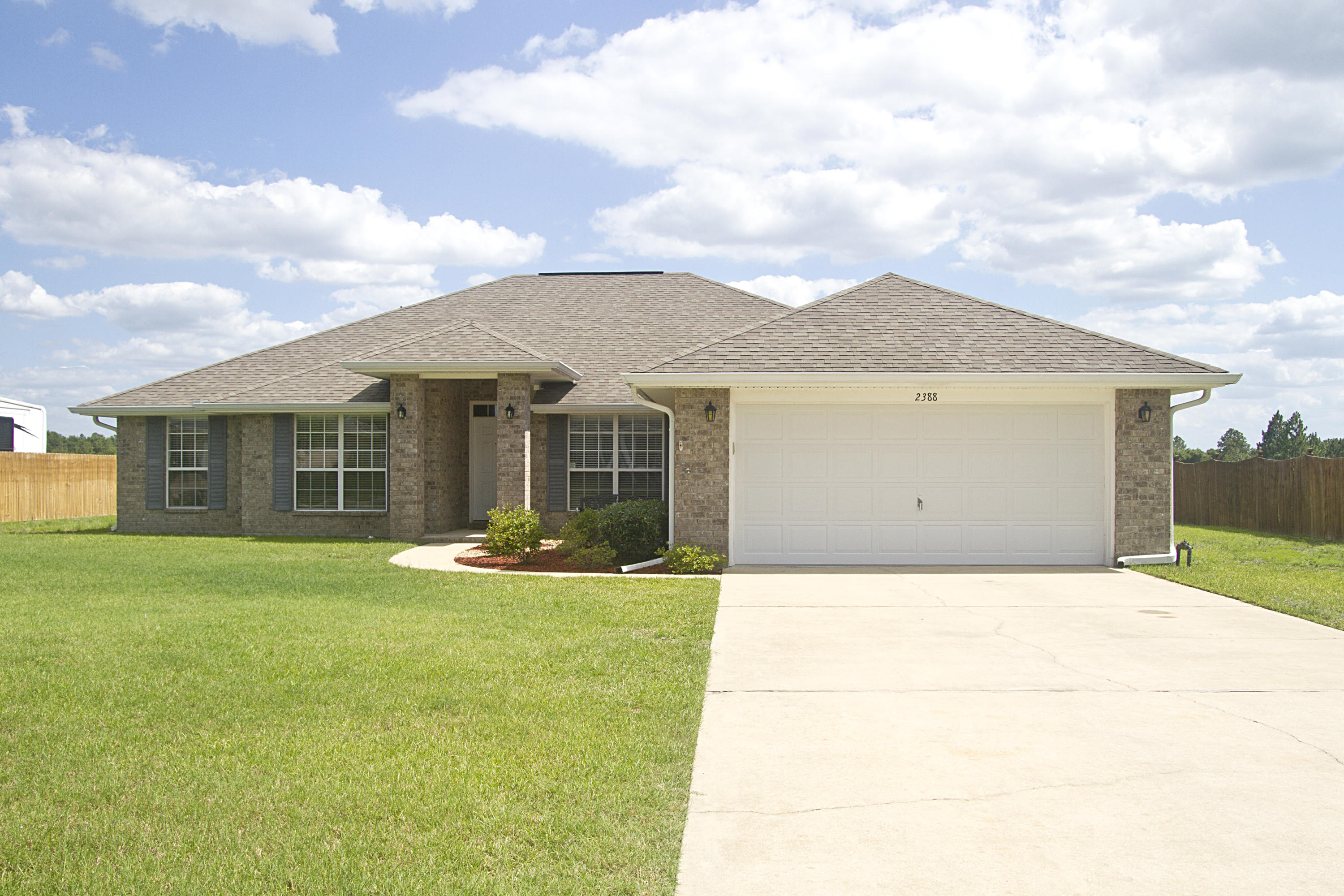 *Motivated Seller, bring all offers*Beautiful all brick 4bd 2bth home on a half acre level lot with sprinkler system & rain gutters. 2 car oversized garage with utility tub/sink. Large family room with fireplace, separate dining room plus living/office/sitting area with crown molding. Large breakfast nook area accompanies the large kitchen with more than ample cabinetry/counter space. Stainless steel appliances, 2 refrigerators, 52in flat screen tv will convey.Split floor plan. Large master bedroom featuring separate his & her walk in closets. Master bath separate shower and garden tub, double vanities. Three additional bedrooms featuring walk in closets. This home has been meticulously maintained and is a blank canvas, ready for you to make it your own!
