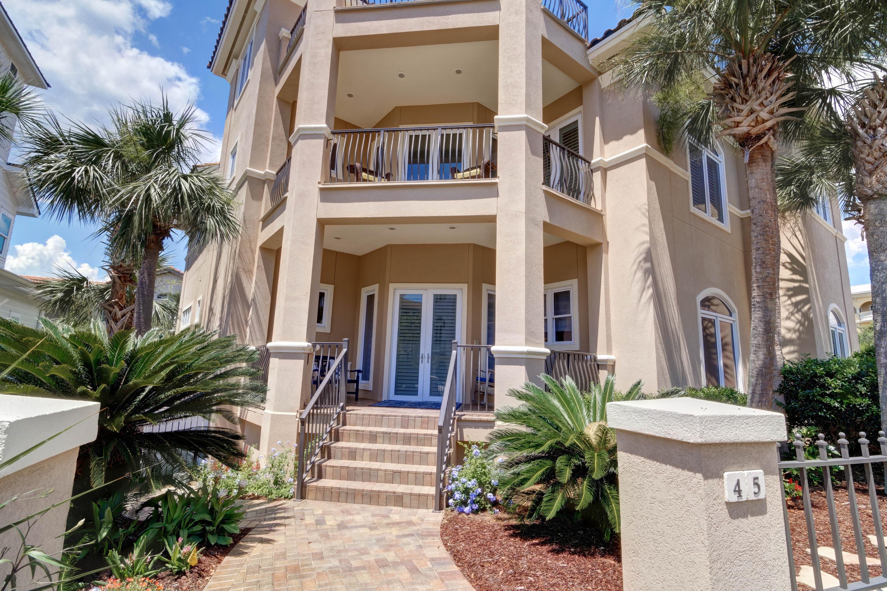 GREAT NEW PRICE This meticulously maintained Beach home offers gulf views and is prominently poised on an elevated site just one lot back from the Gulf and short steps to the neighborhood beach access. It's located in coveted Blue Mountain Beach in the gated rental-restricted enclave of the Village of White Cliffs. This intimate neighborhood of just 61 homesites offers wonderful amenities including a beautiful Clubhouse with gathering center, full kitchen, TV Room, fitness center, a seasonally heated pool and lighted tennis court. The neighborhood beach access leading to the private, pristine beach passes a two-story gazebo that affords breathtaking panoramic Gulf views and magnificent sunsets. This property has brick paver walkways, lush landscaping and tall palms offering privacy. A long