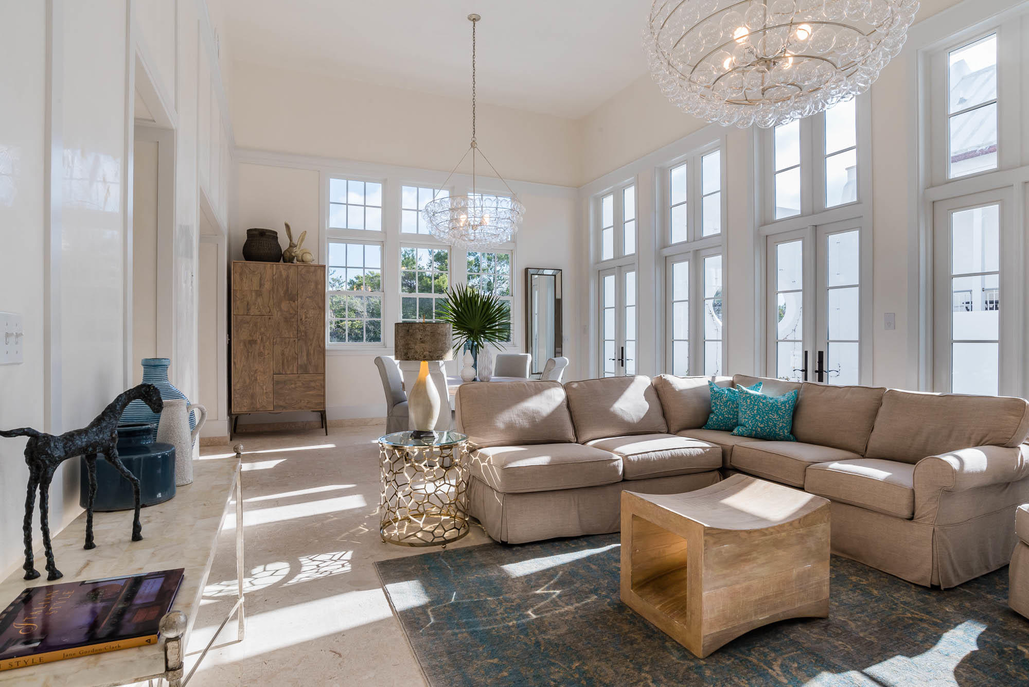 Exceptional location and beautiful architectural details woven into every space of this 4 Bedroom, 4.5 Bath home make this a rare find. Fall under the spell of sophisticated coastal living in a corner situated light-filled private oasis. Caliza Courts rowhomes are designed by the renowned Khoury-Vogt Architecture team and form a welcome addition to the breathtaking Caliza Pool location. Impressive scale of the great room awes with 16-foot ceiling,12-foot tall French doors and windows opening to a private courtyard complete with private heated pool, and guest suite beyond. Floor plan offers the utmost in comfort to accommodate friends and families. Venetian Plaster reflects the elegance of the surroundings. The open concept kitchen offers top of the line Thermador appliances, oakcabinetry