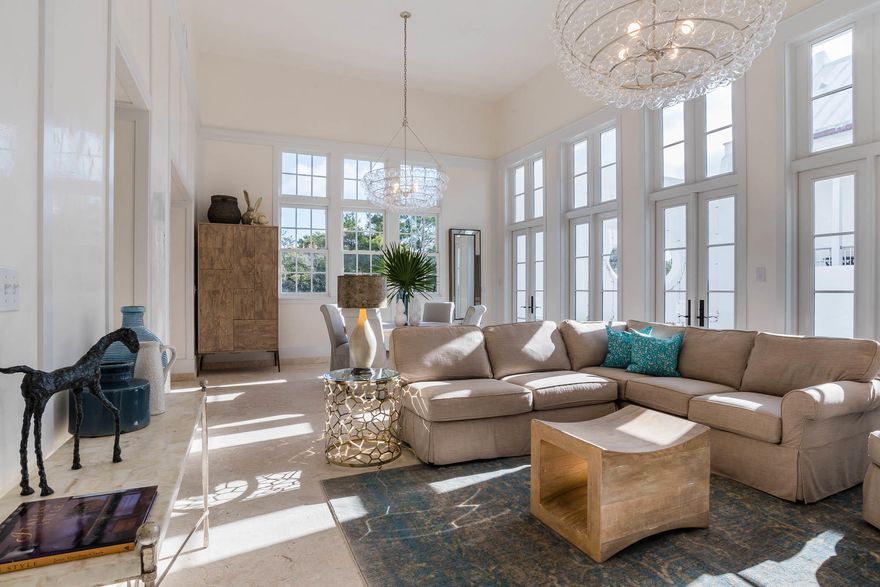 Exceptional location and beautiful architectural details woven into every space of this 4 Bedroom, 4.5 Bath home make this a rare find. Fall under the spell of sophisticated coastal living in a corner situated light-filled private oasis. Caliza Courts rowhomes are designed by the renowned Khoury-Vogt Architecture team and form a welcome addition to the breathtaking Caliza Pool location. Impressive scale of the great room awes with 16-foot ceiling,12-foot tall French doors and windows opening to a private courtyard complete with private heated pool, and guest suite beyond. Floor plan offers the utmost in comfort to accommodate friends and families. Venetian Plaster reflects the elegance of the surroundings. The open concept kitchen offers top of the line Thermador appliances, oakcabinetry