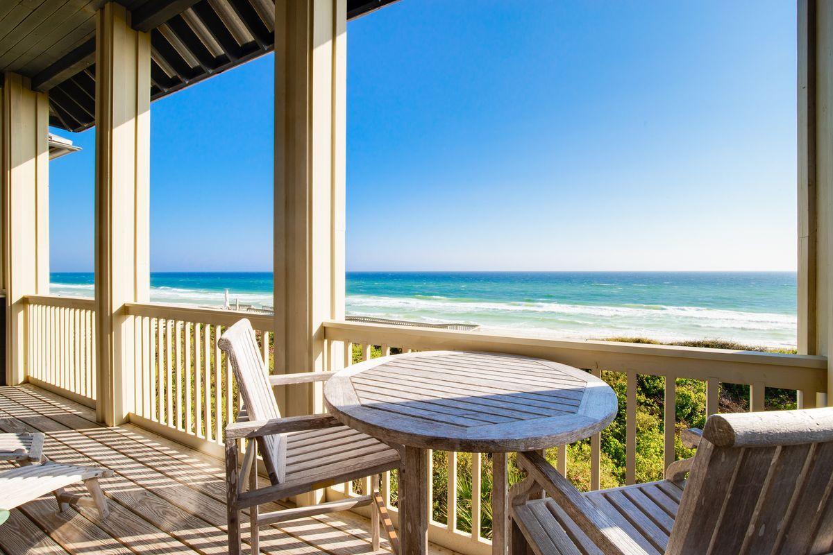 This beachfront cottage has spectacular views of the beach and Gulf with 34 feet of premium Gulf frontage on the less-crowded eastern end of Rosemary Beach. It is fully furnished and move-in or rental ready. Constructed at an elevation of over 30 feet above sea level. The home features an extremely energy-efficient and quiet geothermal HVAC heating and cooling system. The first floor has 10' ceilings with two master suites, each with mahogany French doors connecting to an open Gulf-facing porch. The second story has a high vaulted ceiling and opens to fabulous Gulf views in the family room and dining area through three sets of mahogany French doors and a porch the full width of the home.