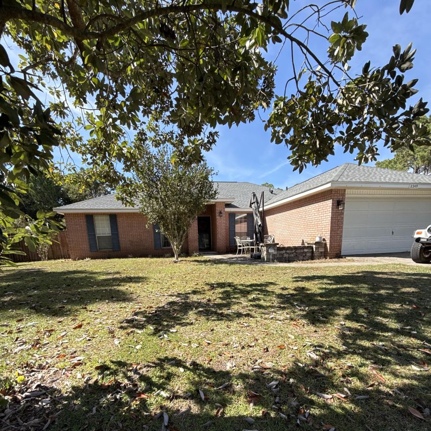 This charming all-brick home features 3 spacious bedrooms, a 4th room that can be used as an office, an open kitchen/dining area, a large open living room, and a dedicated laundry space.   The exterior offers a large expansive yard with a garden-shed, a screened-in back porch and a newer roof.  You will find updated LVP flooring in the living areas and plush carpet in the bedrooms. The bright and airy kitchen includes a breakfast bar, beautiful, tiled floors, and stainless-steel appliances. This home is situated in Holly by the Sea which offers a grand recreation center that has something for everyone! As a resident in one of Navarre's most desirable neighborhoods, Holley By-The-Sea, you'll enjoy membership in an impressive multi-million dollar recreational and clubhouse facility that includes: 3 pools, sauna and steam room, gym, tennis and pickleball courts, community room, playground, softball field, track, basketball courts, deeded access to Santa Rosa Sound with a private pier, boat/kayak launch, sandy beach, and picnic pavilions.