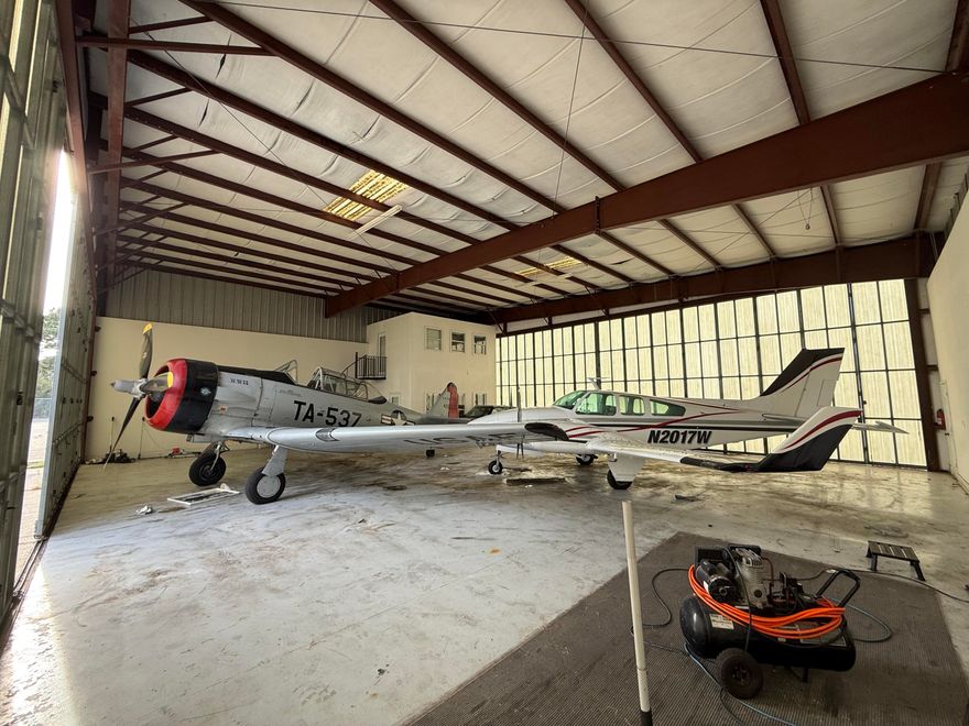 Protect your plane in this fantastic airplane hangar at Destin Executive Airport! Pristine space to park your plane and vehicles. Hangar is 3,116 sq ft at approx. 58ft wide and 50ft deep with both front and rear doors measuring approx. 56ft wide and 16ft tall. Conveniently integrated inside the hangar, the two-story office space measures approx 16'x12' on each floor and currently features a well-appointed ground-floor workspace and an upstairs bedroom and bath, creating the perfect blend of productivity and relaxation between flights. Ground Lease with Okaloosa County is until 5/17/2033. 2025 Ground Lease (10/1/25 - 9/30/26) payment of $6,397.89 has been paid. All ground leases are adjusted annually to reflect increases in the Consumer Price Index based on a 12-month September through  August average.

Located in the heart of the Emerald Coast, Destin Executive Airport serves as an essential transportation hub for Okaloosa County, offering a 5,000-foot runway, full-service general aviation amenities, and unmatched proximity to the South's most beautiful beaches, renowned golf courses, and world-class fishing. Atlantic Aviation, the airport's full-service Fixed-Base Operator, provides 100LL and Jet A fuel along with premier conveniences including 24-hour surveillance and security, concierge services, a pilot's lounge, snooze rooms, showers, Wi-Fi, crew cars, Go Rentals, and a conference room. With its close proximity to Destin and first-class facilities, Destin Executive Airport offers both convenience and privacy for private-jet owners.

This purchase is for an assignment of ground lease and must be approved by the Okaloosa County Airport Authority. Buyer to confirm all measurements and information they deem important.