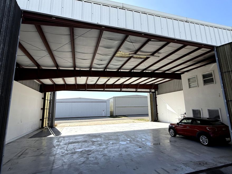 Protect your plane in this fantastic airplane hangar at Destin Executive Airport! Pristine space to park your plane and vehicles. Hangar is 3,116 sq ft at approx. 58ft wide and 50ft deep with both front and rear doors measuring approx. 56ft wide and 16ft tall. Conveniently integrated inside the hangar, the two-story office space measures approx 16'x12' on each floor and currently features a well-appointed ground-floor workspace and an upstairs bedroom and bath, creating the perfect blend of productivity and relaxation between flights. Ground Lease with Okaloosa County is until 5/17/2033. 2025 Ground Lease (10/1/25 - 9/30/26) payment of $6,397.89 has been paid. All ground leases are adjusted annually to reflect increases in the Consumer Price Index based on a 12-month September through