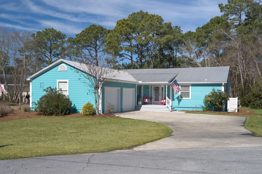 LOCATION IS SUPERB with NO HOA!  Beautiful 3 bed, 2 bath cottage located in the heart of Santa Rosa Beach! Minutes from Sandestin Resort, Baytowne Wharf, Grand Blvd, 30A area, Topsail State Park, and across the street from Sacred Heart Hospital. Fantastic home full of light with a great open living area and kitchen.  Granite counters and SS appliances.  Beautiful tile throughout - no carpet.  Two-car garage with plenty of room for all your beach toys.  Split floor plan with master suite on one side and two bedrooms and a full bath on the other. Spend your peace filled mornings and evenings in the spacious screen room or back patio. Metal roof and newly painted fiber-cement siding makes this home low maintenance. HVAC 2014. Home warranty included and in effect through July 2028.