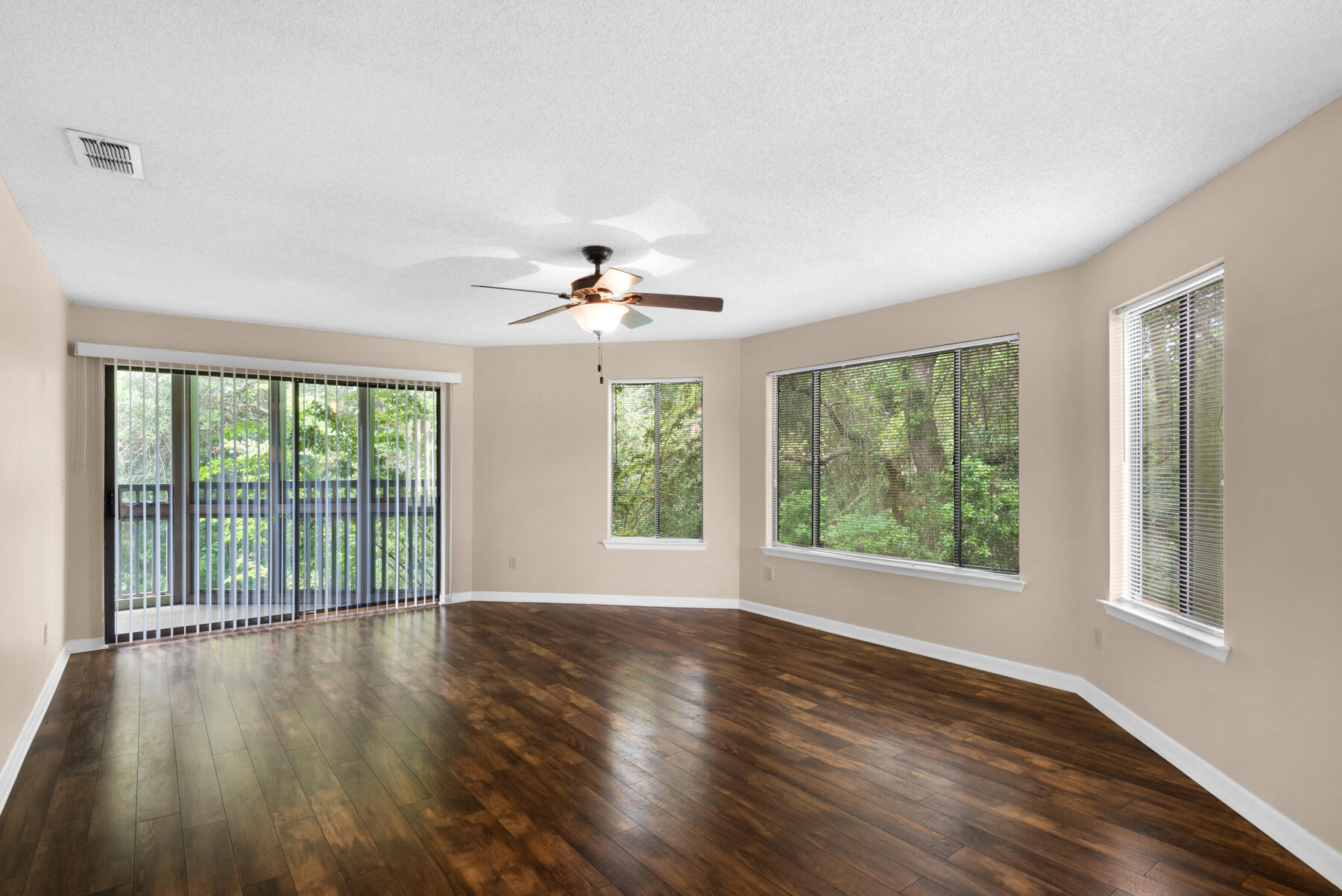 Available Sept 4, This is a tastefully updated 2 bedroom / 2 bath condo tucked in the trees. Leave your work worries behind and enjoy your favorite beverage as you relax on your 'treehouse' screened balcony that is accessible from either the living room or one of the bedrooms. The other bedroom his its own open balcony for extra privacy. This condo unit has a designated parking spot directly in front of the unit. Once inside you will notice features like wood look plank flooring, lots of windows and an open living and dining room combination. With a breakfast bar open to the dining and living areas. Granite and stainless with an attached laundry closet are samples of the kitchen updates. Both bathrooms have updated lighting, vanities and fixtures. Bedroom comfort features include ceiling