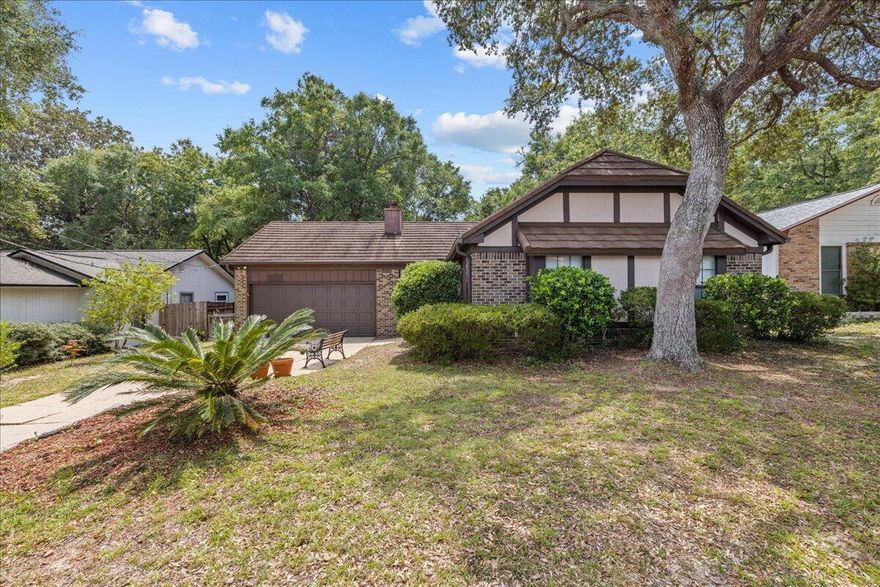 You won't want to miss out on this beautiful Tudor-style home located in the heart of Niceville! The floor plan is complete with an updated kitchen, two living areas, a dining nook, and three spacious bedrooms. The two car garage and large laundry room offer plenty of storage. Off the back of the house, you will find a wonderful deck where you can enjoy a peaceful, private backyard. For your peace of mind, this home has a steel roof and new water heater. It is just a short distance away from top-rated schools, shopping, and restaurants! Book a showing today!