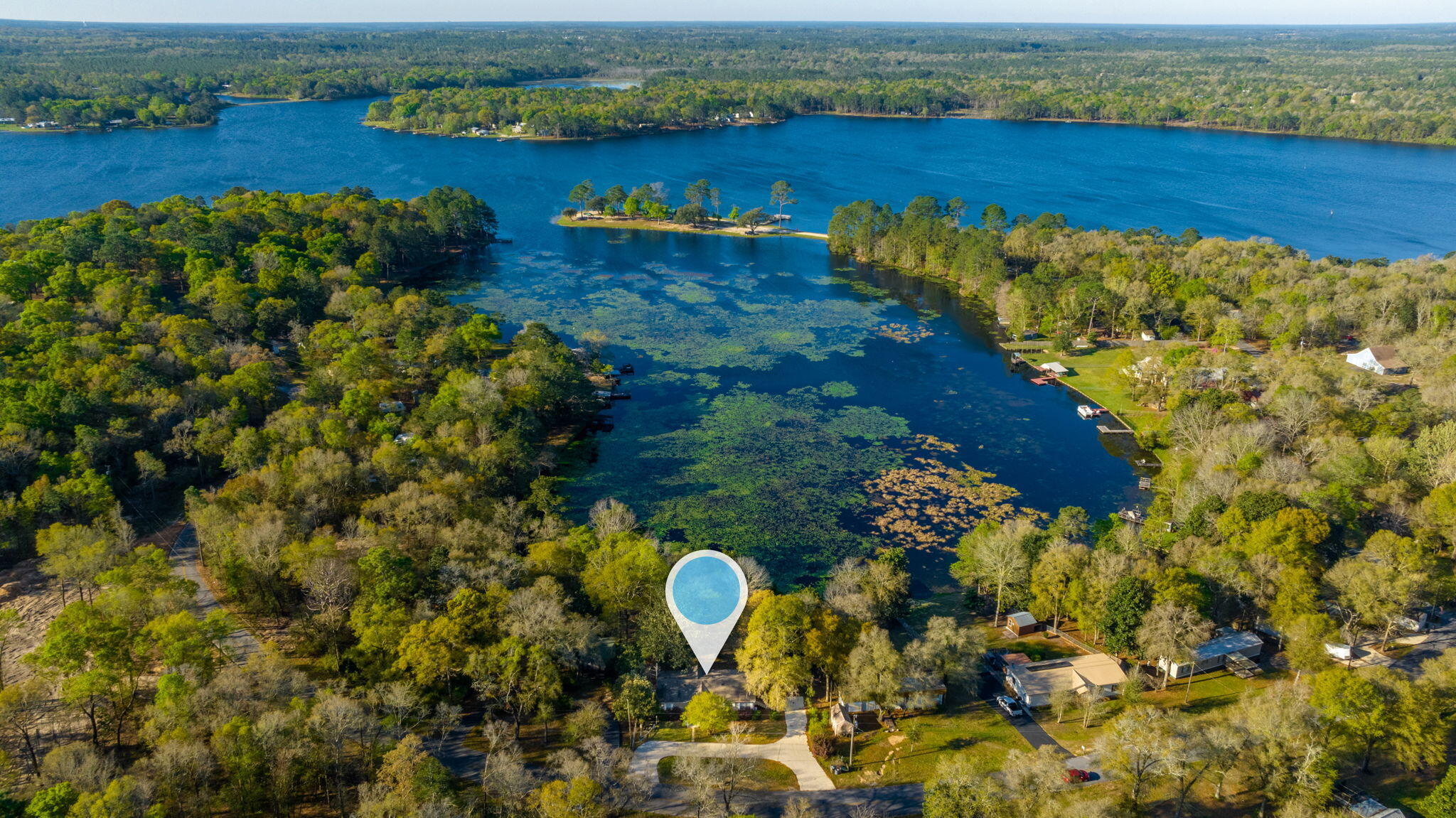 LOCATION LOCATION!!!Wether your looking for a forever home, stepping stone or a perfect vacation spot! This beautiful Lake Front home is the ideal location for you.  Bring your boat and your fishing poles ,this property features and boat house and a dock. Enjoy some relaxation time on the beautiful Juniper Lake!