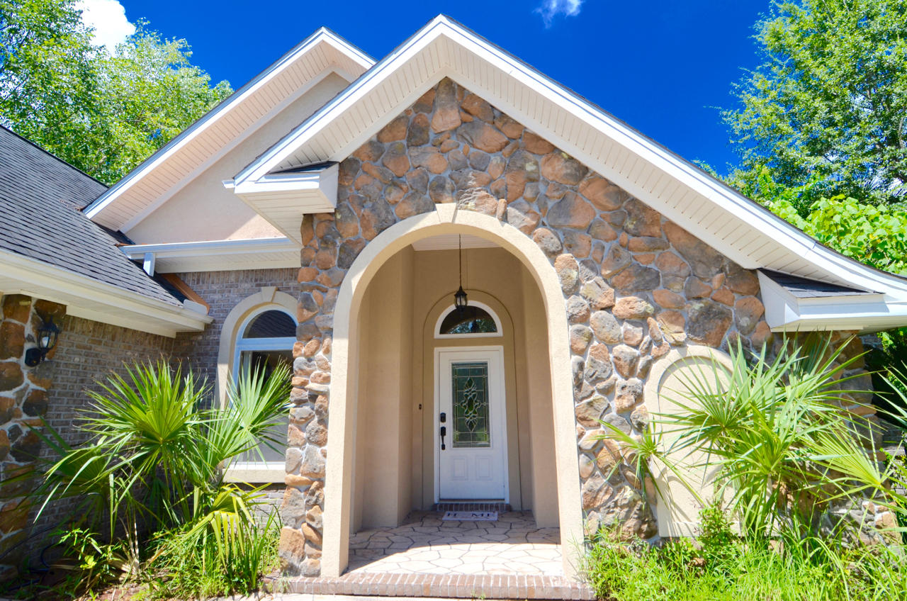 JUST REDUCED $5000! Located in the beautiful gated community of Claire's Vineyard. This 2004 Parade of Homes Winner is a 3 bed 2.5 bath home located on a well manicured corner lot with an arched entry way, stone, stucco and hammered copper accents and an over-sized side entry garage with ample storage. Upon entering the home you will notice the attention to detail with crown molding throughout, vaulted tray ceilings, recessed lighting, 14 inch tile floors, the kitchen has granite counter tops, gas stove, stainless steel appliances & oak cabinets, white Brazilian pecan porcelain tile in Florida room, remote controlled gas fireplace, spacious bedrooms with wood floors and plenty of natural light, rod iron fencing in backyard with brick columns and more. Buyer to verify all information import The master suite has a huge walk-in closet with natural light, a master bath with whirlpool tub, separate walk-in shower with anodized bronze tile mosaics and double marble vanity. Other features include a large laundry room with storage, a separate office, an ADT home security system, all exterior lighting is with led lights and remote phone control. Outside of the beautiful Florida room is a lush courtyard with a gas grill enclosed in wrought iron fencing with brick columns