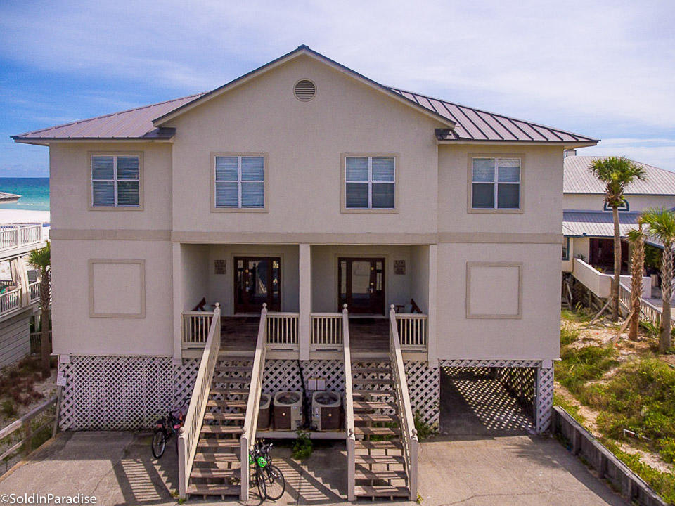 EXCEPTIONAL INCOME PRODUCING PROPERTY: GROSS RENTAL INCOME 2014-$192,000; 2015-$205,000; Projected 2016-$245,000 This Grayton Beach home is located in the community of Gulf Trace, a beachside community of 86 residential lots surrounded by state parks on the east & west and by the Gulf of Mexico on the south. This residence consists of two homes under one roof. With 10 bedrooms & each with a private bath, 2 kitchens, 2 dining areas, and 2 large living spaces, this home can comfortably accommodate 32 or more guests. This home sits on over a half acre of land and has 75 feet of pristine and private beach frontage. Expansive porches on two levels provide panoramic views of the beach & down the coastline. It can be rented as a 10 BD/10 BA or as two 5BD/5B