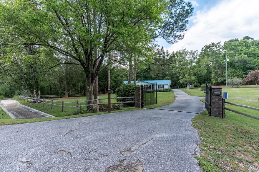 Who wants to live beside PROTECTED BLACKWATER RIVER STATE FOREST?BLACKWATER RIVER ESTATE IS NOW AVAILABLE... and features an EXOTIC AVIARY WITH 300 RARE BIRDS... AND IS NESTLED BESIDE BEAVER CREEK! #AttentionNatureLoversWelcome to 7075 FL-4.. a gated estate bordered by Blackwater River State Forest, and recently transformed.The entrance is impressive with SOLAR-POWERED SECURITY GATES.. SPLIT RAIL FENCING.. AS WELL AS ELECTRIC FENCING. Thousands of dollars went into new landscaping and hardscaping (front and back).. and the owner recently added 2 BIG BONUS FEATURES to the estate!BONUS #1--- CUSTOM GAZEBO WITH POWER steps away from the creek, offering 360 DEGREE VIEWS OF FLORA AND FAUNA! The gazebo boasts an old-fashioned wood burning stove at its center. (continued) BONUS #2---CUSTOM EXOTIC AVIARY-- home to 300 VERY RARE Australian Gouldians. See pictures in the photo lineup. The current owner enjoys aviculture, but the aviary could easily transition to a chicken coop or green house. #YouDecide

There are several fruit and nut trees on the property, as well as berry bushes and hard woods. There's also covered parking behind the home and an expanded driveway that will accommodate multiple vehicles (boats, RV, Campers, Trailers, etc). 

The 2074 sf estate was built to last.. with a heavy duty METAL ROOF.. QUALITY CRAFTMANSHIP.. AND STATELY COLUMNS. The quintessential southern-style front porch was resurfaced, and new staircase added. 

Step inside to GRAND LIVING with original hardwood floors, rustic charm and large picture windows offering unparalleled views of nature.

The formal dining room was recently painted and boasts crown molding, window casings, and wainscoting.

The country kitchen offers UNTAPPED EQUITY for the savvy buyer, and features wood cabinets, laminate counters, white appliances, an expansive breakfast bar and a coffee bar/beverage station. The pantry is located in the laundry room. Check out the size of the laundry room. #LARGELAUNDRY

There are 3 spacious bedrooms, with good-sized closets... and an ENORMOUS BONUS ROOM that could easily serve as a 4th bedroom (gameroom, craftroom, master suite). 

The home comes with 1 large bathroom, but the owner is offering ANOTHER BONUS--- BATHROOM #2. The owner will add a 2nd bathroom prior to close, with acceptable offer. He's already hired the contracter! #BringYourOffer

Blackwater River State Forest homes rarely come on the market! Now is your opportunity to connect with nature and make this property your own. Better Hurry! This one is priced to move!








