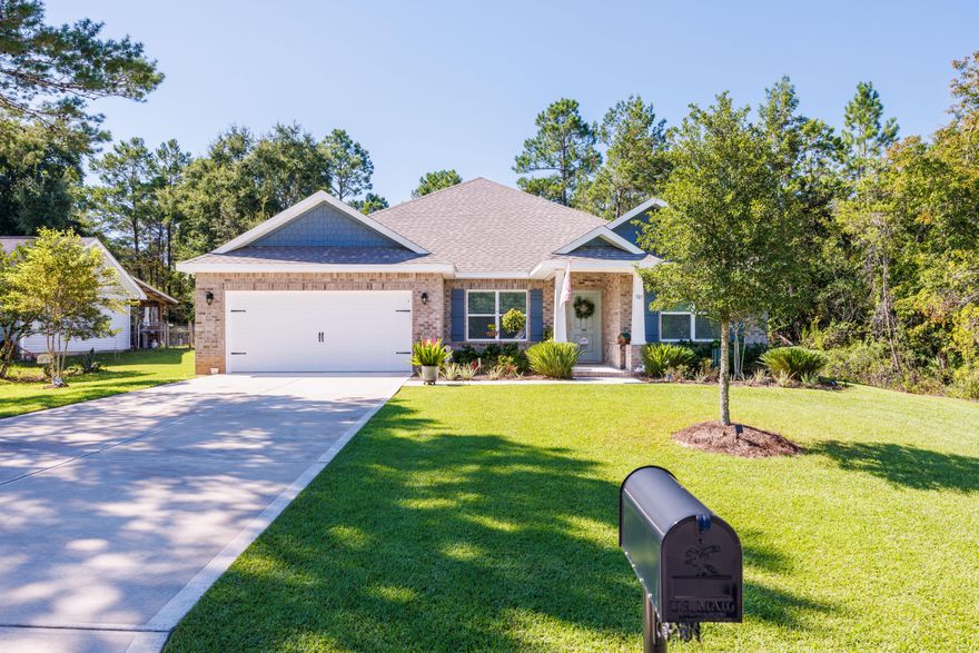HUGE $20K PRICE IMPROVEMENT plus SELLERS' OFFERING $10,000 TOWARDS CLOSING COSTS!!!  A Home Where Style Meets Comfort & Offering Amazing Seller Incentives for your convenience & Peace of Mind w/acceptable offer (1 Year Home Warranty)!!Nestled on nearly half an acre of beautifully landscaped land, this 2023-built home is the perfect blend of modern elegance and everyday comfort. Beyond the pristine fenced backyard, a wooded backdrop creates a sense of privacy and peace--giving you the best of both worlds: neighborhood living with a touch of nature's serenity.Step inside and you'll immediately notice the thoughtful upgrades that set this home apart. The grand foyer opens into spacious living areas adorned with engineered Shaw Polaris Plus vinyl plank flooring, flowing seamlessly into the kitchen, baths, and laundry room.

Natural light fills the open floor plan, highlighting custom 42-inch cabinetry with crown molding, upgraded granite and quartz countertops, and elegant brushed nickel and stainless finishes throughout.

The chef's kitchen is both functional and stylish, featuring a Samsung Wi-Fi refrigerator, stainless appliances, and a microwave vented to the outside. A brass floor receptacle in the living room adds a touch of convenience, while upgraded LED lightingincluding a full package in the great room, dining room, and master suitesets the perfect ambiance for both gatherings and quiet nights in.

The home offers 4 bedrooms and 3 full baths, with upgraded carpet in the bedrooms for comfort underfoot. The primary suite is designed as a retreat, complete with a spa-like en-suite and carefully chosen finishes that elevate everyday living.

Step outside and the lifestyle continues. An enclosed back patio leads to a 10x16 deck, perfect for hosting summer barbecues, while the 12x20 workshop/shed gives you space for hobbies, storage, or projects. The irrigation system with well keeps the lush landscaping thriving, and the upgraded exterior brick and siding finishes ensure long-lasting curb appeal.

With no HOA, ample parkingincluding an oversized driveway and garage spaceand countless thoughtful upgrades, this home offers more than just square footage. It's a place where every detail has been considered, every space has been designed to welcome you, and every corner invites you to relax and stay awhile.
Location - Where Convenience Meets Coastal Living

Located in Freeport, Florida, this home offers the charm of small-town living with unbeatable access to the best of the Emerald Coast. Perfectly situated between Destin, Panama City Beach, and Fort Walton Beach, it provides easy commutes to Eglin AFB and Hurlburt AFB. Just 30 minutes from the sandy white beaches of Florida's Emerald Gulf Coast, you'll also enjoy nearby Choctawhatchee Bay fishing, endless shopping, dining, and entertainment options.

This isn't just a houseit's a home built for memories, offering the lifestyle you've been dreaming of.

*Seller's Warranty is American Home Shield Complete - One year
*Sellers' offer of $10,000 towards buyers' closing costs with acceptable offer.