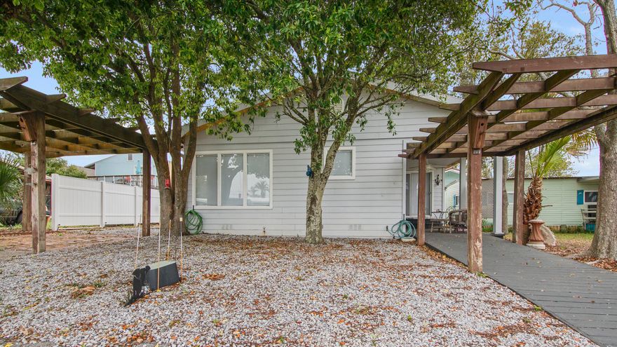 Amazing income potential on this short term rental!!! This turnkey property is located 2 blocks from the beach in a golf cart friendly community. The main home has 3 bedrooms and 2 full bathrooms. Upstairs is a large bedroom with a half bath. Currently sleeps 12 with the potential for more. 2 outdoor seating areas,  firepit, dedicated storage building, and much more. The current owner has used this home as an AirBNB property with great success over the last 3 years. The annual rental projection on this property is over $90k.