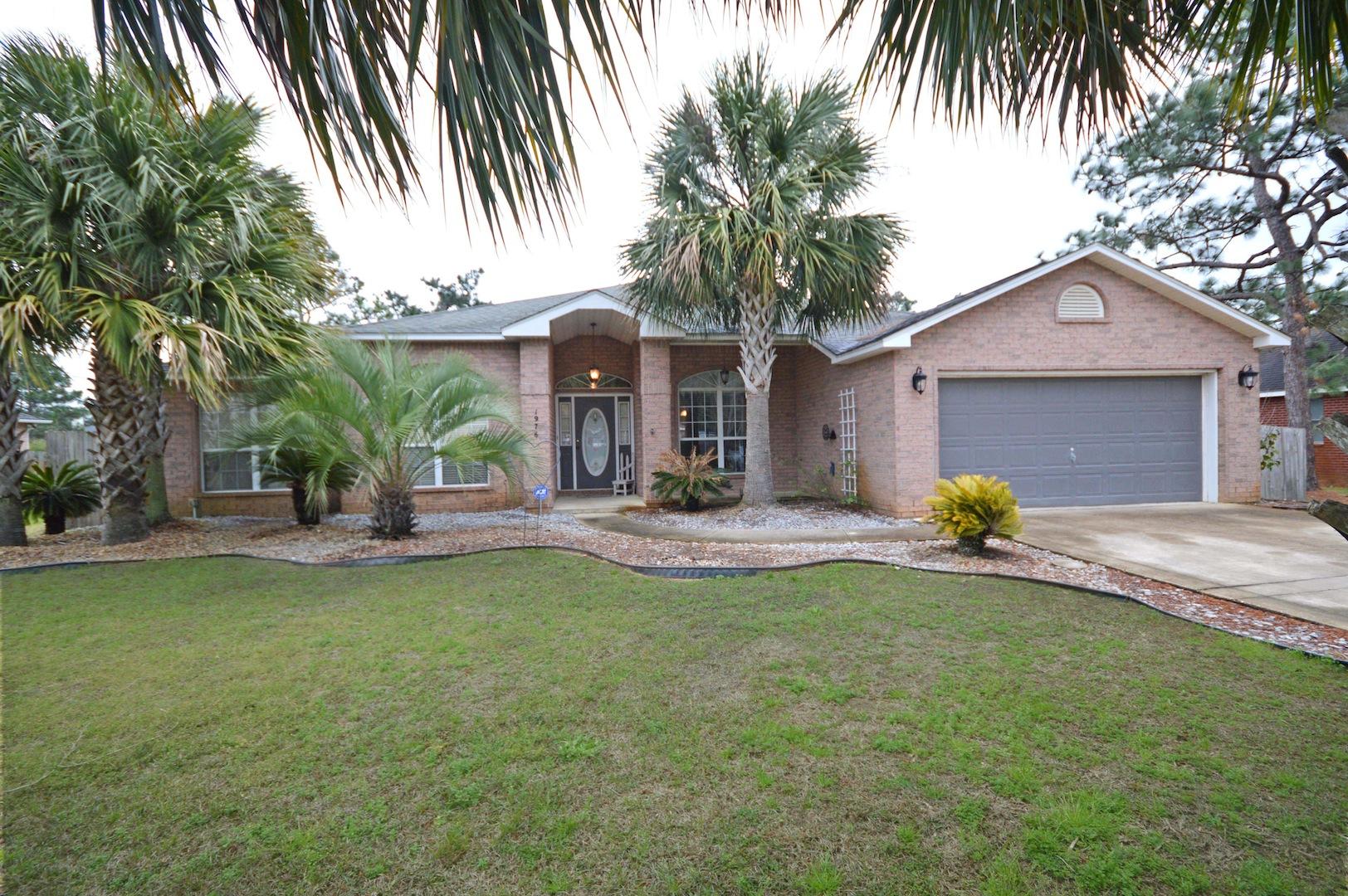 Welcome home! Here is your roomy, well laid out, 4 bed, 3 full bath home in HBTS. Large entry hall welcomes you with glass door and high ceilings; spacious kitchen with beautiful cabinets & a bright eat-in kitchen. Kitchen has tiled backsplash and a large island for entertaining and cooking! Side alley laundry room with 2 additional storage areas.There is also a gorgeous formal dining room, a large lovely living room with space enough to entertain. Home has a separate, roomy den or office. From the large living room, you walk out of large glass doors into an extra large screened in lanai, set on the original concrete slab. Master bedroom has French doors that lead out to Lanai; along with trayed ceiling, double vanity, double closets, whirlpool tub, and a separate shower! Separate room for toilet for extra privacy. Home has a 6 foot wood privacy fenced in the back yard. There is also a 2 car garage. Take advantage of this reasonably priced home and make any updates you might need to make it your own. Home comes with membership to the multi-million dollar recreational center with 3 pools, tennis courts, gym and multiple activities! Come see your new home today!
