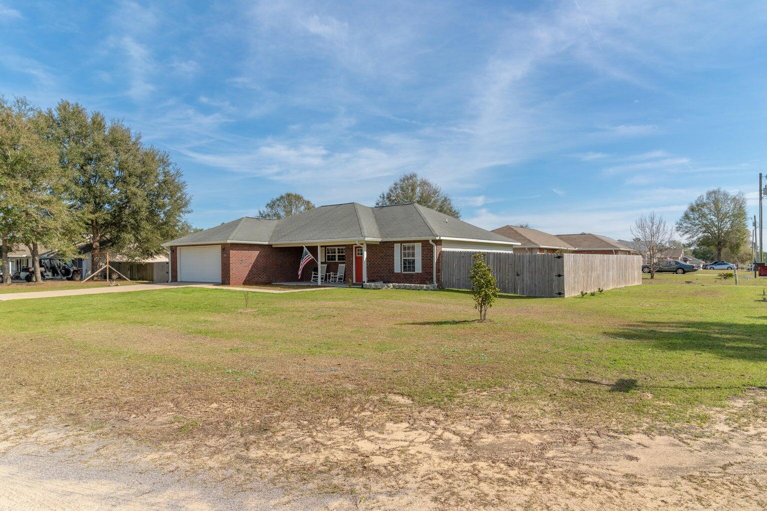 Stylish Renovation in a Serene Neighborhood! This open spaces await in this beautifully updated home, tucked away in a country setting. Move-in ready and full of charm, this home features a bright, open layout with updated flooring throughout the main living areas. The renovated kitchen impresses with granite countertops, a striking tile backsplash, stainless steel appliances, an oversized farmhouse sink, and contemporary lighting. The kitchen flows seamlessly into the spacious living and dining rooms, enhanced by modern shiplap accent walls and updated fixtures throughout. The large primary suite includes a stunning en-suite bath with a double vanity, vessel sinks, and LED-lit mirrors--perfect for getting picture-ready! This is a beautifully updated and affordable opportunity!