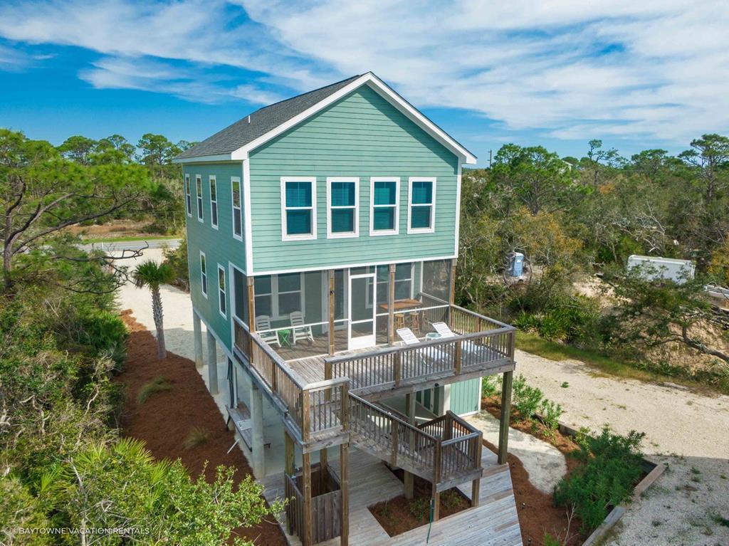 Gulf front home located on Indian Pass with beautiful views of the Gulf of Mexico and St. Vincent Island. This turn key and established income producing homes is truly one of the best gulf front values along ''The Forgotten Coast!'' Bring your swimsuit, fishing gear, boat, and golf cart as this beach cottage is located only about 1/2 mile from the end of the Indian Pass boat launch and vehicle access point which affords a great opportunity to explore the beaches and enjoy numerous outdoor activities. 1st floor has ample parking for 3 or 4 vehicles with room for boat parking, storage room, enclosed hot and cold shower, fish cleaning station, gas grill, and a private boardwalk to the beach. 2nd level has open deck, screened in porch living, dining, kitchen, laundry room, and half bath.
