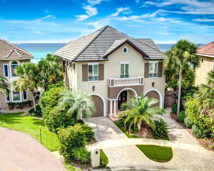 Enjoy gorgeous, unimpeded Gulf views and easy beach access from this lovely home on Scenic 98 directly across from the Gulf of Mexico. As part of Avalon Estates, the home enjoys a private gated beach and large community pool with tennis courts. The Mediterranean-style residence features attractive iron wrought details, stucco finish, and decorative shutters on the exterior, with high ceilings, wide crown molding, travertine and scraped wood floors, and a contemporary color palette on the interior. The light-filled open-concept living room and kitchen are situated on the second floor to make the most of the fabulous views of sparkling blue water, white sand, and glorious sunsets. Both the living room and the adjacent formal dining room feature vaulted plank ceilings...
