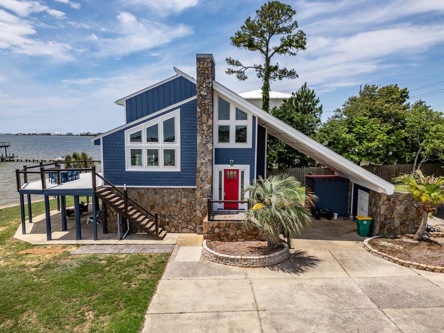 Stunning Gated Waterfront Estate - Experience the ultimate in coastal living with this exceptional 3-bedroom, 3-bath private estate, perfectly positioned on a pristine stretch of waterfront. Offering over 3,000 square feet of beautifully renovated living space, this home combines beach elegance with modern comfort, all framed by panoramic water views.  Fully renovated from 2017-2022, the home boasts a bright, open floor plan ideal for family living and entertaining. The spacious living areas flow seamlessly into the gourmet kitchen and outdoor living areas, all overlooking the sparkling waters. Huge deck with 180 degree sunrise to sunset views.230 ft. concrete capped sea wall, roof 2022, HVAC 2017,  heated, enclosed pool, dock, boat slip, new hurricane Windows and Doors. Also on  the property with a water view, don't miss The "Love Shack" 1970 authentic enclosed life guard shack converted with power, A/C, TV and queen size bed. 
Car port has 2 large enclosed storage sheds built in and a smaller closet for outdoor equipment, tools and pool accessories.
Not enough can be said about this Emerald Coast Jewel. Currently rented and heavily booked as an AirBnB generating incredible income. Possibilities are endless for future owners....Dream home, generate income and use it when you want, or dial in on a great investment property.