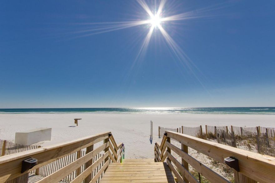 Walk out your door to the Gulf! DON'T MISS this stunning1st floor beachfront condo, fully renovated in 2024. This beautifully updated unit features 2 full bathrooms. The layout includes a luxurious custom king bed with two floating twin beds, plus Full-over-Full hallway bunks with privacy curtains--perfect for families or groups. Enjoy the ease of first-floor access with no stairs or elevators. Step right outside to your private patio with direct views of the pool and the emerald waters of the Gulf. The beach is just steps away, making it your personal backyard retreat. Located in a prime spot directly across from the Silver Sands Outlet Mall, Chick-fil-A, and Winn-Dixie groceries store, you'll have shopping and dining at your fingertips.GROSSED OVER $84K IN 2024.