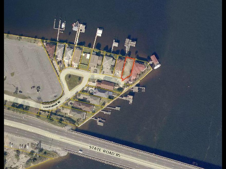 ONE OF A KIND TREASURE! Sensational waterfront lot in Fort Walton Beach situated on Choctawhatchee Bay and Garniers Bayou. Enjoy some of the best views available along the Emerald Coast. Conveys with a deep water dock & boat slip with a fortified seawall. Dock has been rebuilt and brand new lift 10,000 lbs. lift has been added. All dimensions and information herein is deemed reliable, but should be verified by buyer.