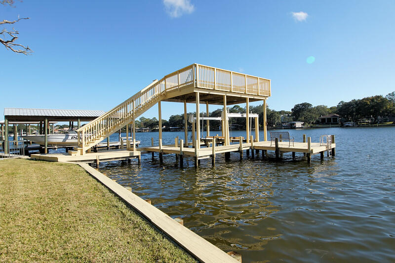 This .66 acre lot with all brick home and an above garage apartment situated on protected deep water offers so much!- great views, quick access to the gulf and intercoastal waterways and minutes from hwy 98, shopping, Hurlburt Field and Eglin AFB.  Waterfront living at its finest!This home was taken down to the studs in 2005 and by 2006 all renovations were completed- new plumbing, new electrical, new everything and a 50 year roof. This home has been well cared for every since and it shows throughout the home and grounds. The main home has 3 bedrooms and 2.5 baths on the upper level and 1 bedroom 1 bath on the lower level. Also on the lower level is another large living room/den/entertainment room. The above garage apartment is approx 675 sq ft not including it's own patio d