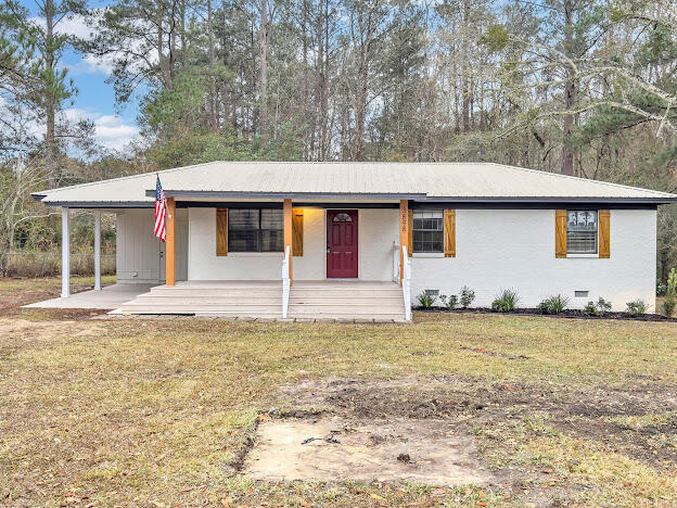Little doll house on 2.2 AcresCompletely updated !!! New Well, New Ac and hot water heater, Metal roof in great shape new paint,new kitchen with stainless appliances, new paint in and out ,new bathroom, new floors, new ceiling texture,new fans and lights, new hot ater heater!!Huge back porch ....