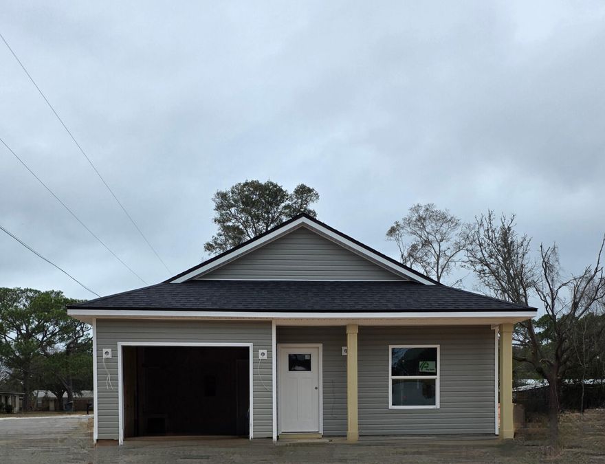 Presale opportunity on a beautifully designed JGraham Contracting new construction home featuring 3 bedrooms, 2 baths, and a 1-car garage, ideally located just minutes from the Navy base, shopping, dining, and entertainment. This thoughtfully planned home offers a spacious primary suite with an elegant tray ceiling, plus a spa-like bath complete with a double vanity and walk-in closet. The open-concept kitchen is a standout, showcasing a center island, shaker-style soft-close cabinetry, and ample counter space--perfect for the home chef and effortless entertaining. Buyers have the rare opportunity to request select spec changes up to two weeks prior to construction start. Additional features include non-impact windows with fabric hurricane protection and placement in an X flood zone--no  flood insurance required. Secure this home early and personalize your new construction before it begins!