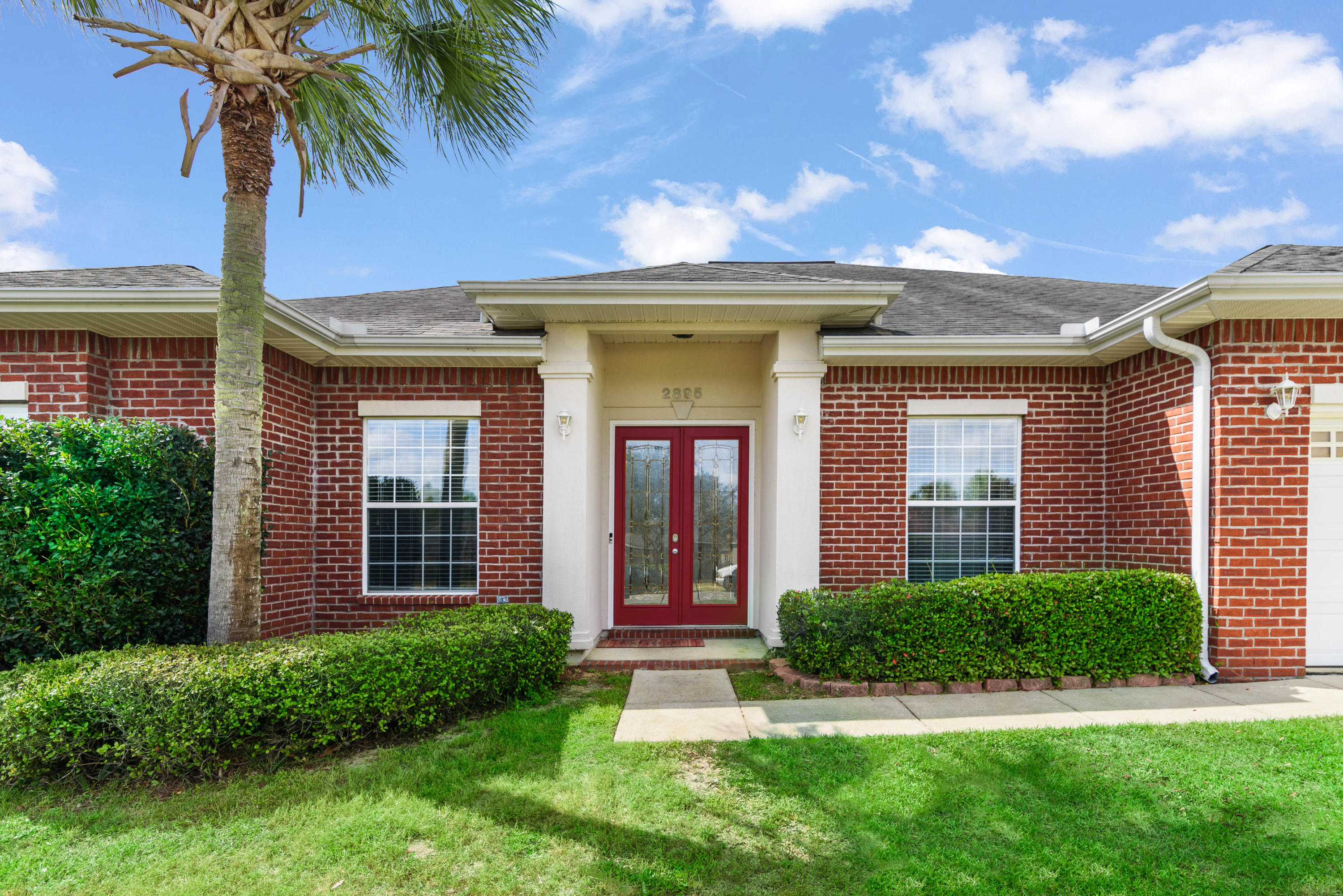 Chanan Estates is a beautiful neighborhood close to 7th Special Forces Group and Eglin AFB. This is a spacious home in a gated community south of I-10 that includes four bedrooms, three full bathrooms. This beauty is an all brick home with stucco accents and columns situated in a cul de sac and features tall ceilings, hardwood floorings and tile throughout the open floor plan. There is a formal living room, dining room and a separate study off the foyer with beautiful French doors. The kitchen features stainless steel appliances, gas stove/oven, an island bar and Corian countertops. The kitchen opens to a cozy family room with a gas fireplace and built-in shelving which makes the home ideal for families and entertaining.