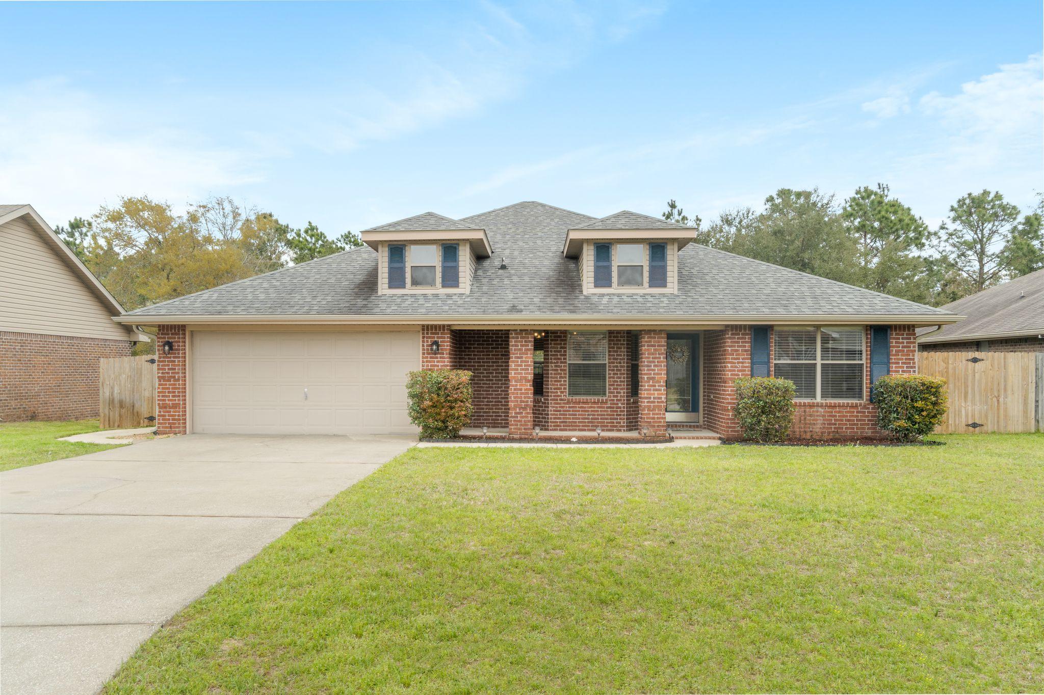 If you're looking for an updated 4-bedroom home in Navarre, be sure to add this one to your list! This 2010 built home features so many upgrades throughout. The outside of the home has a beautiful front porch, gorgeous red brick, spacious garage, fenced-in backyard, and a lovely back deck that overlooks the creek. This semi-open floor plan is great for entertaining guests and enjoying cooking meals while watching TV. Upgrades include a brand-new HVAC, 2020 hot water heater, sprinkler system, updated flooring, beautiful painted cabinets, new kitchen hardware, new stainless steel kitchen appliances, updated windows in 2019, huge front and back porch, and new light fixtures throughout the home. There is also a survey available. Be sure to schedule your showing today before it is gone!