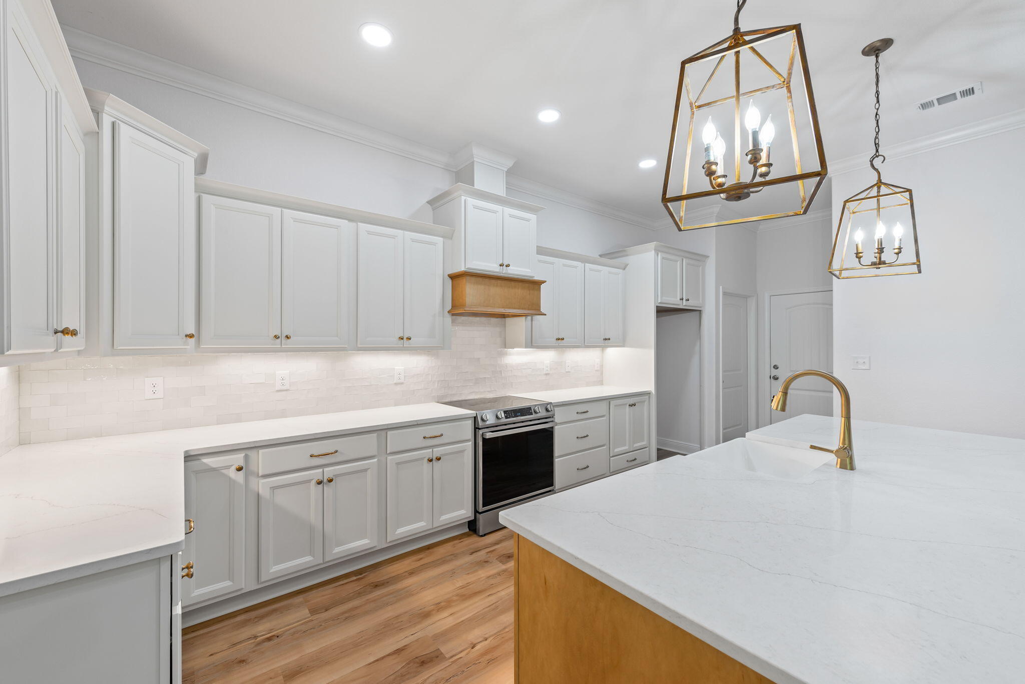 Step into the epitome of Craftsman elegance with this stunning new construction property, meticulously designed to capture the essence of this beloved architectural style. Nestled within a vibrant community and idyllic cul-de-sac, this home seamlessly blends traditional craftsmanship with modern amenities, offering a haven of comfort and sophistication. From the moment you arrive, the charming exterior beckons with its classic Craftsman features. A welcoming front porch invites you to sit back and savor the neighborhood ambiance, while tapered columns and an array of brick combined with hardie board, flanked by attractive shutters make a statement of timeless elegance. Step through the threshold and into a world of refined luxury. The interior showcases exquisite attention to detail,
