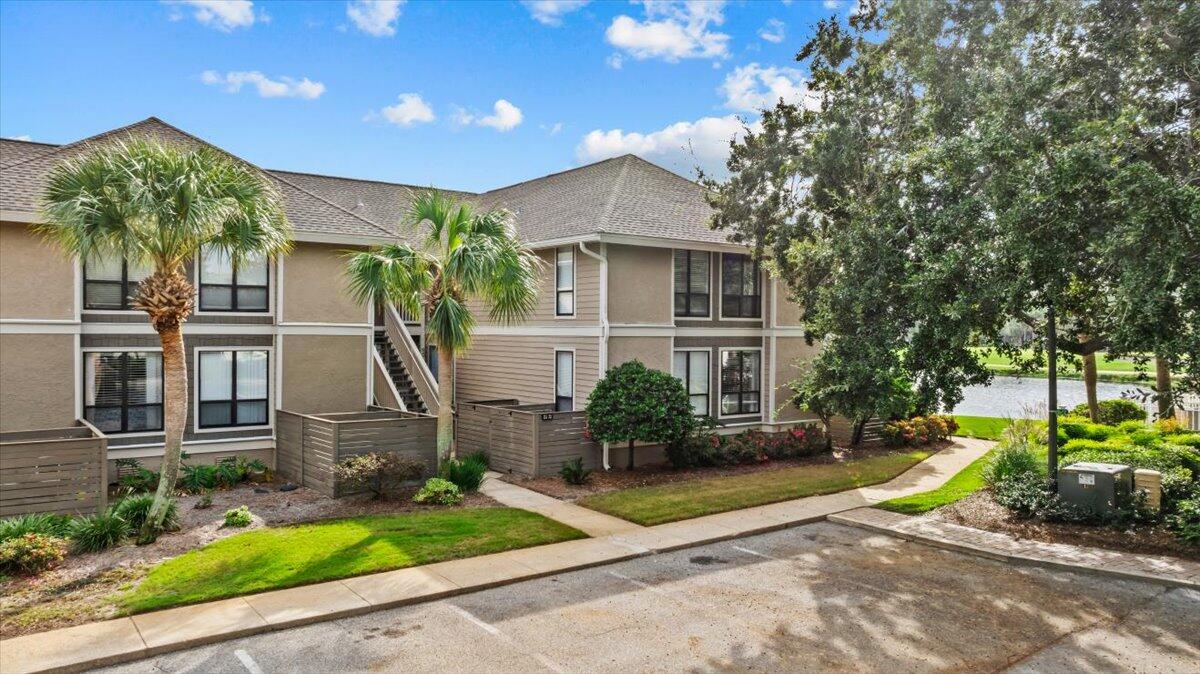 Perched on the Links Golf Course, this top-floor corner unit is a true gem. Enjoy  panoramic views of the lake and golf course, perfect for savoring warm breezes and stunning sunrises and sunsets. Styled in coastal luxury, the condo features new furnishings, LP flooring, fresh paint, and an open floor plan with water views from the kitchen, dining, and living areas. The kitchen is a chef's dream with granite countertops, stainless steel appliances, and two breakfast bars accented by Serena & Lilly barstools. The bright and airy master bedroom boasts a serene partial water view.  Additional perks include outdoor storage for your bikes and beach gear, plus easy access to Sandestin's world-class amenities--pools, golf, tennis, the beach, marina, dining, and entertainment. This is a gem!