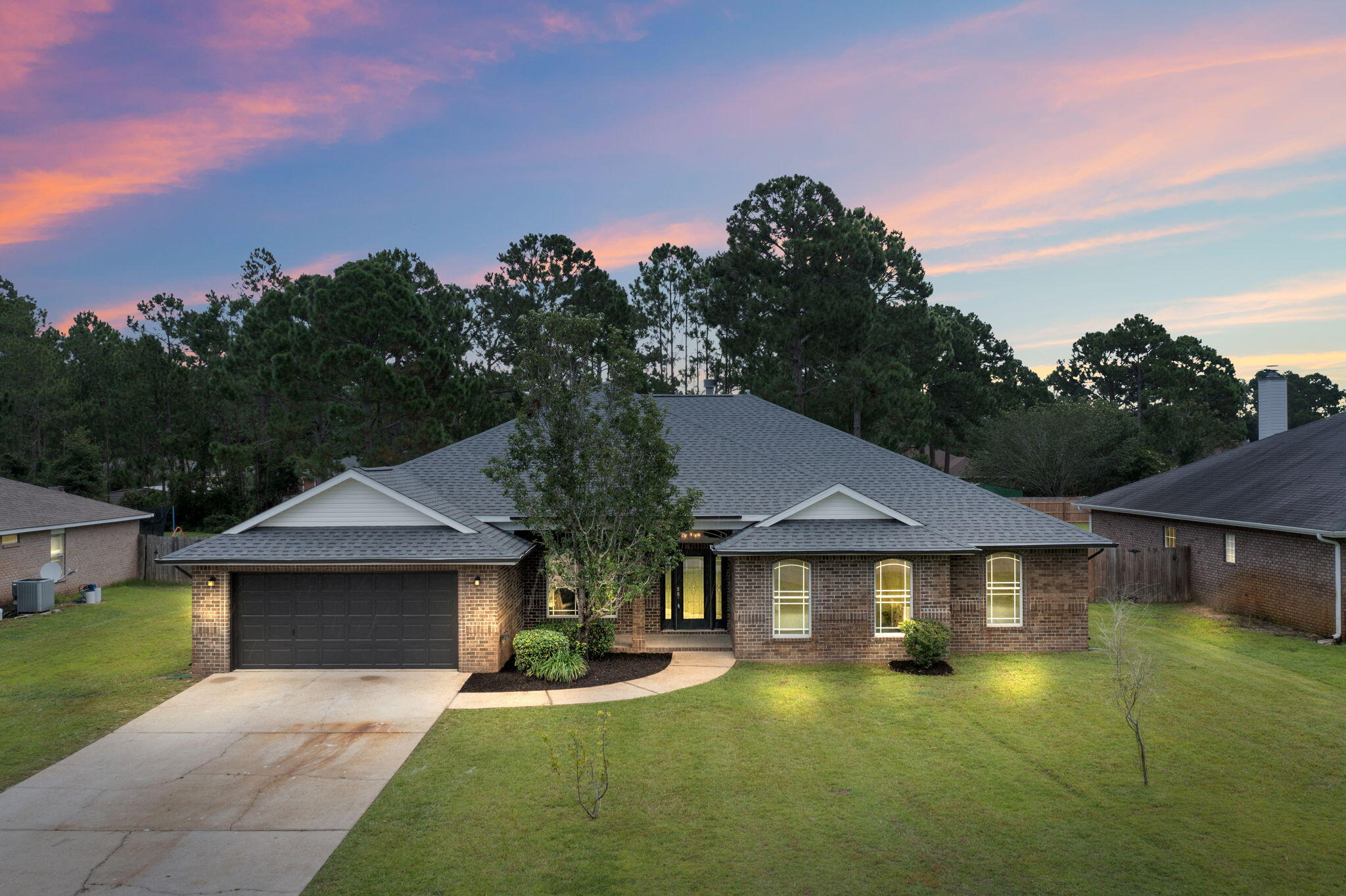 This gorgeous, renovated home is located in the highly sought-after community of Holley By The Sea. This home offers a large great room area with a fireplace and a separate private seating area. Just off the main living area and the kitchen is a large outdoor covered patio area where you can relax or host barbecues with friends. Enjoy an eat-in kitchen with granite countertops and new stainless-steel appliances, plus a coffee bar, a large breakfast bar, and an abundance of storage. The primary bedroom offers a massive ensuite with a soaking tub, a separate shower, double vanity vessel sinks, and a custom countertop. This home features a great floor plan with five nicely sized bedrooms and two full baths. There are so many updates in this home!