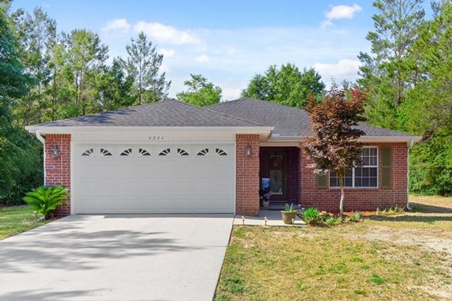 What a great all brick home in a quiet setting outside of the city limits. The curb appeal is beautiful with new landscaping and an inviting front entrance. The floors of the home are tile, carpet and laminate wood flooring. The living room has a vaulted ceiling and new recessed lighting for added ambiance and a modern appeal. The bedrooms are spacious with large closets for storage. In the master you will find a spacious area large enough for king size furniture and an on suite with double vanities and a walk in closet. The kitchen is a galley style with beautiful cabinetry and solid surface counters, stainless steel appliances and tile floor. Out back there is a 15x11 screened in patio and a large 12x24 shed. This home is situated on over an acre with cleared areas as well as trees.