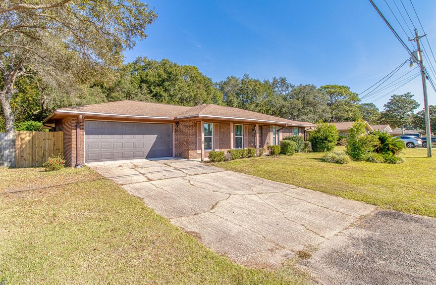 Updated home in the heart of Shalimar, close to base and the beach!  Features 4 bedrooms, 2 baths, and a large living area overlooking the kitchen. Additional room can be used for a formal living, dining, or office space. Newly walled garage includes an electric car plug-in! A screened-in porch overlooks large backyard that backs up to base land.  Recent updates include: electrical panel, garage sink, HWH, electric outlets, door hardware, lighting, fencing, kitchen counters, appliances, HVAC, thermostat, windows, and exterior doors.  Don't miss this one!