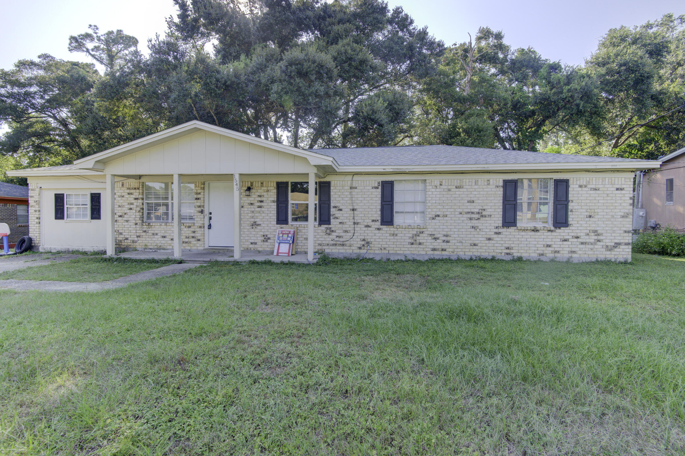 beautifully renovated home offering modern comforts and timeless charm. Nestled in a serene Pensacola neighborhood, this property is perfect for those seeking a fresh and inviting living space. Every detail has been thoughtfully updated to provide a cozy, worry-free rental experience. Property Highlights Brand-New Roof Enjoy peace of mind knowing the home is protected by a newly installed roof, ensuring durability and enhanced energy efficiency. Modern Rewiring The entire property has been rewired to meet modern electrical standards, ensuring safety and reliability for all your devices and appliances. Luxury Vinyl Plank Flooring Gorgeous new flooring flows throughout the home, offering the perfect blend of durability and style. Bright, Upgraded Lighting Thoughtfully installed modern ligh fixtures create a warm and inviting ambiance in every room. Sleek, Updated Kitchen The completely renovated kitchen boasts brand-new cabinets, countertops, and state-of-the-art stainless steel appliances. Whether you're a culinary enthusiast or prefer quick meals, this kitchen is sure to impress. Elegant Bathroom Upgrades Enjoy beautifully remodeled bathrooms with contemporary fixtures, finishes, and tiling for a spa-like experience. Stylish New Doors and Windows New doors and energy-efficient windows enhance the aesthetic appeal while improving insulation and natural light throughout the home. Spacious Bedrooms Each bedroom has been updated with fresh paint, new flooring, and ample closet space, creating a restful retreat for tenants. Curb Appeal The property features a clean, inviting exterior with fresh landscaping, a manicured lawn, and a welcoming front entrance. Additional Amenities Central air conditioning and heating Washer and dryer hookups Ample parking space, including a driveway and on-street parking A large backyard, perfect for outdoor activities or relaxation . Conveniently located by schools, parks, shopping centers, and dining